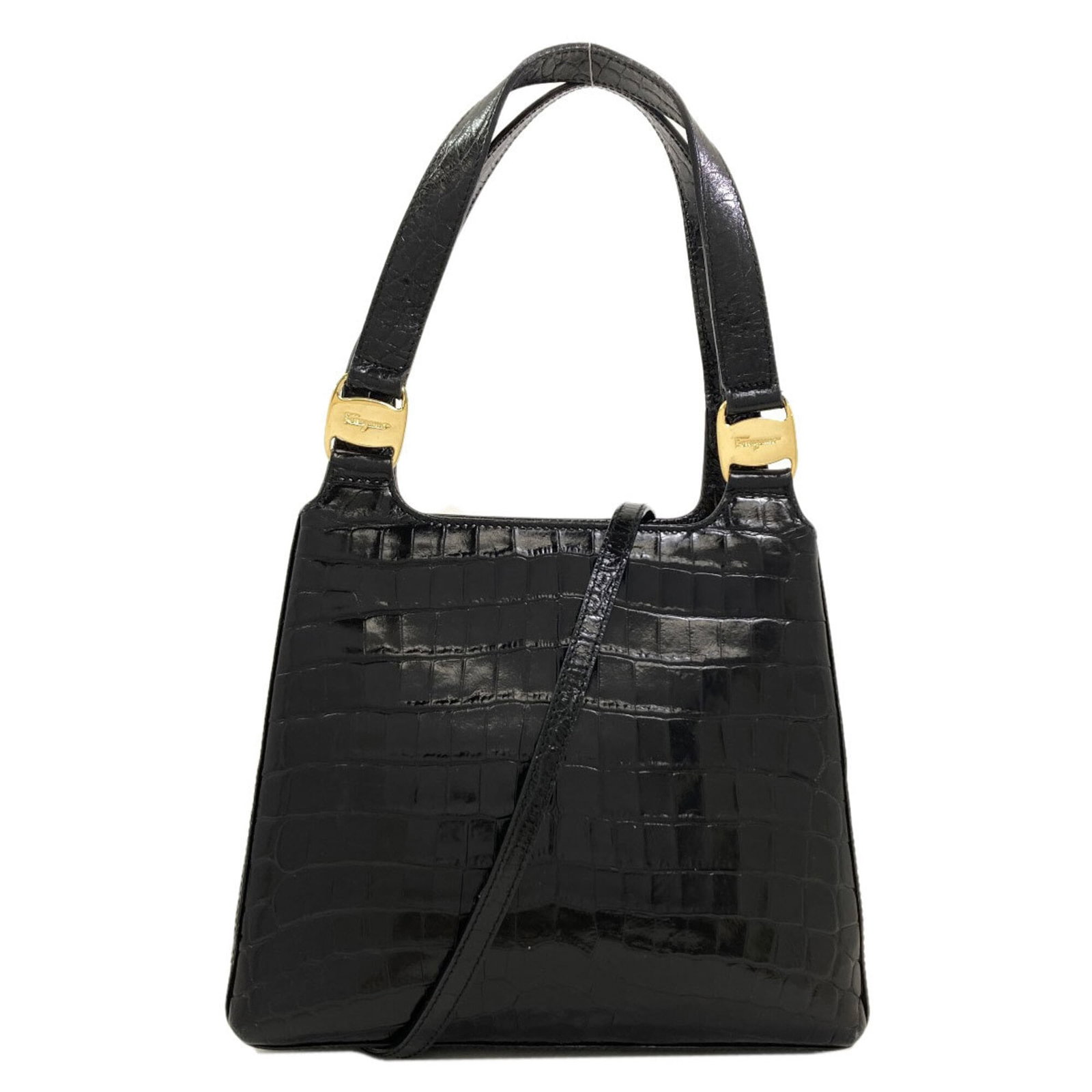 Salvatore Ferragamo Handbag Leather: Salvatore Ferragamo Handbag Leather Black Salvatore Ferragamo handbag made from high-quality leather, featuring a hook closure and measuring 18cm x 22cm x 8.5cm in size. The bag has a long handle at
