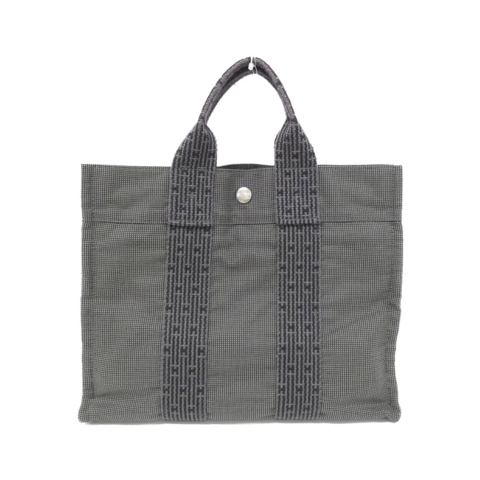 Handbag Canvas by Hermes: Handbag Canvas by Hermes Canvas by Hermes, a sleek and sophisticated black handbag with clean lines and a compact size. Measuring 23cm x 31cm x 8cm, it offers a stylish and portable option for