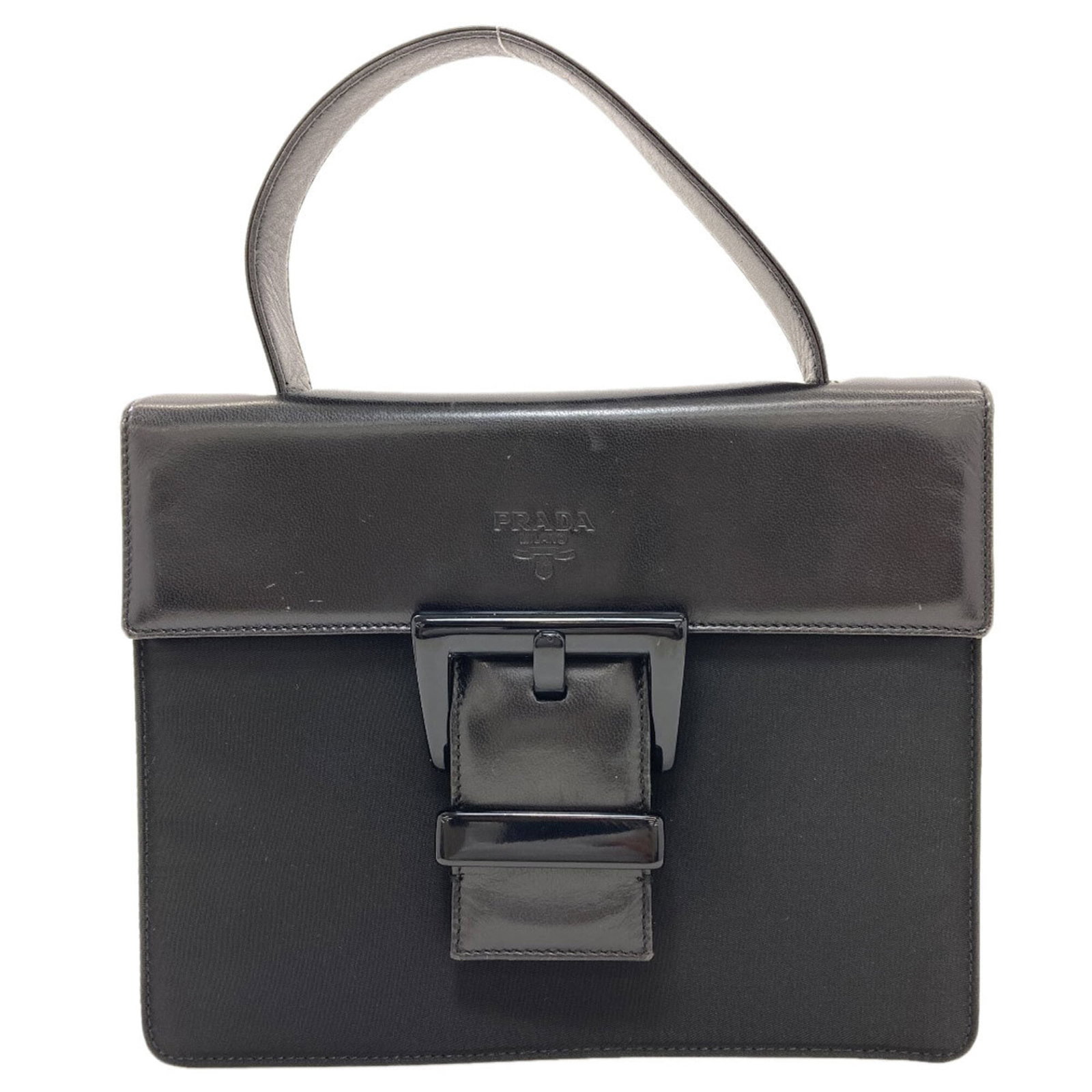 Nylon Leather Handbag Prada: Nylon Leather Handbag Prada Nylon and leather blend in sleek, modern design. The black color provides a versatile backdrop for everyday use. With its compact size, this Prada handbag is perfect for ca