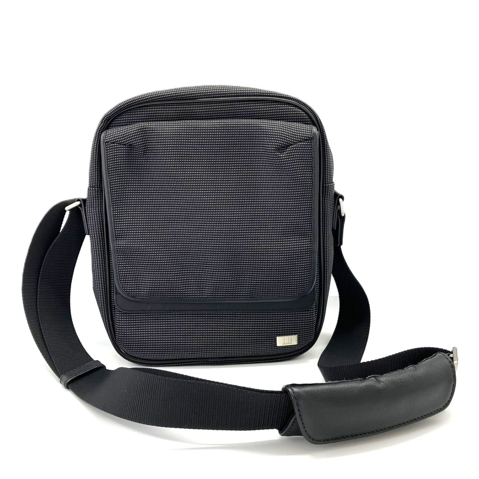 Nylon shoulder bag from Dunhill: Nylon shoulder bag from Dunhill The Dunhill MPN AV6020A nylon shoulder bag boasts a sleek black design, measuring 28cm x 22cm x 6.5cm in size. Made from high-quality nylon material, this stylish