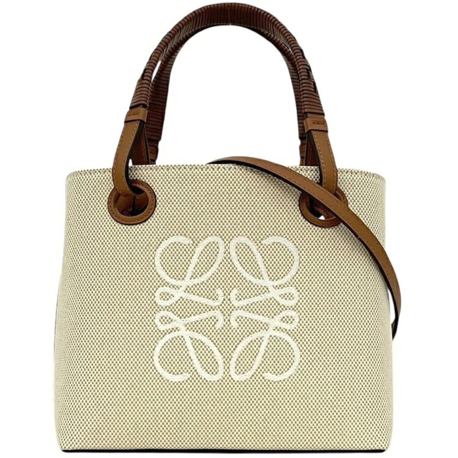 Loewe Handbag Tote Bag Canvas Leather: Loewe Handbag Tote Bag Canvas Leather Canvas and leather blend in this classic Loewe tote bag, available in beige and brown hues. Measuring 19cm x 25cm x 9cm, it offers a stylish and spacious design. 