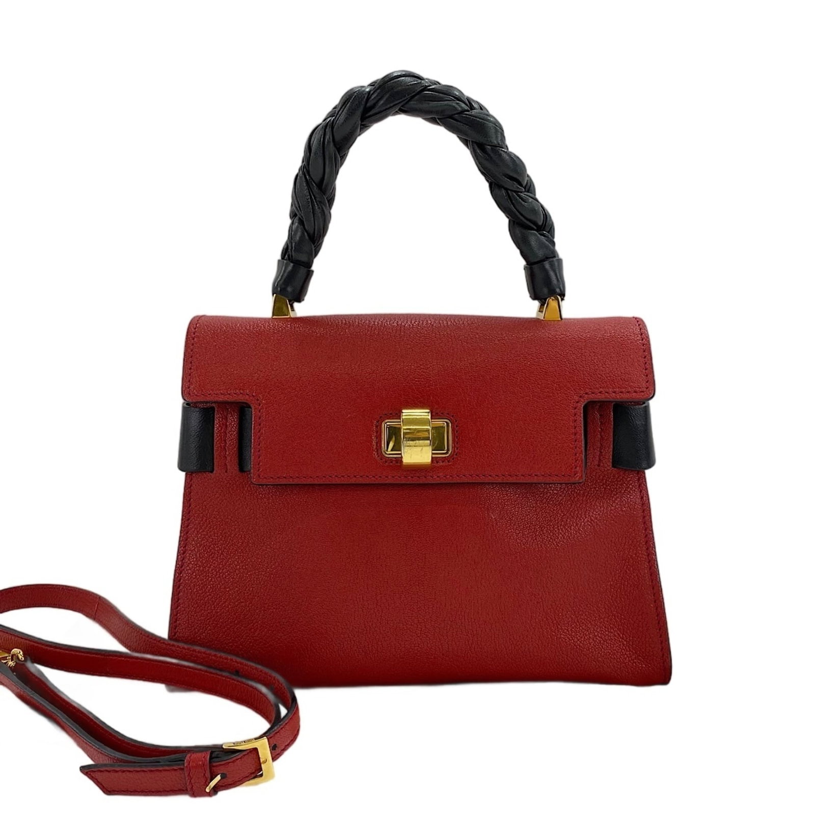 Handbag Miu: Handbag Miu The Miu Miu Handbag boasts a striking red color, adding a pop of vibrant hue to any outfit. Measuring 19cm x 27cm x 13cm, its compact size makes it perfect for everyday use. With its