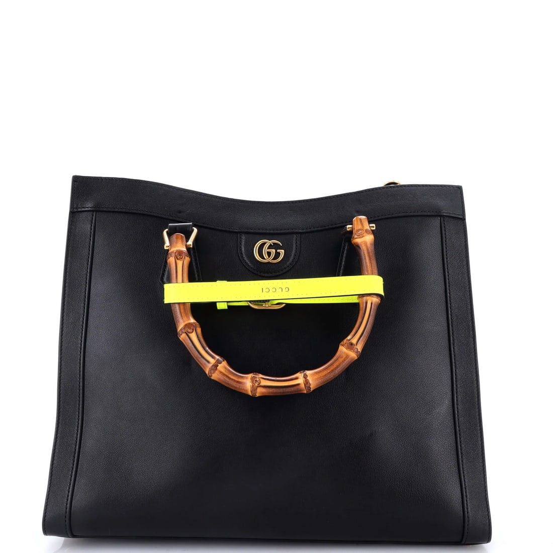 Diana NM Leather Handle Bamboo Tote Gucci Medium: Diana NM Leather Handle Bamboo Tote Gucci Medium Black leather exterior, gold hardware, and neutral microfiber interior make up the Gucci Diana NM Bamboo Handle Tote Medium. This medium-sized tote fea