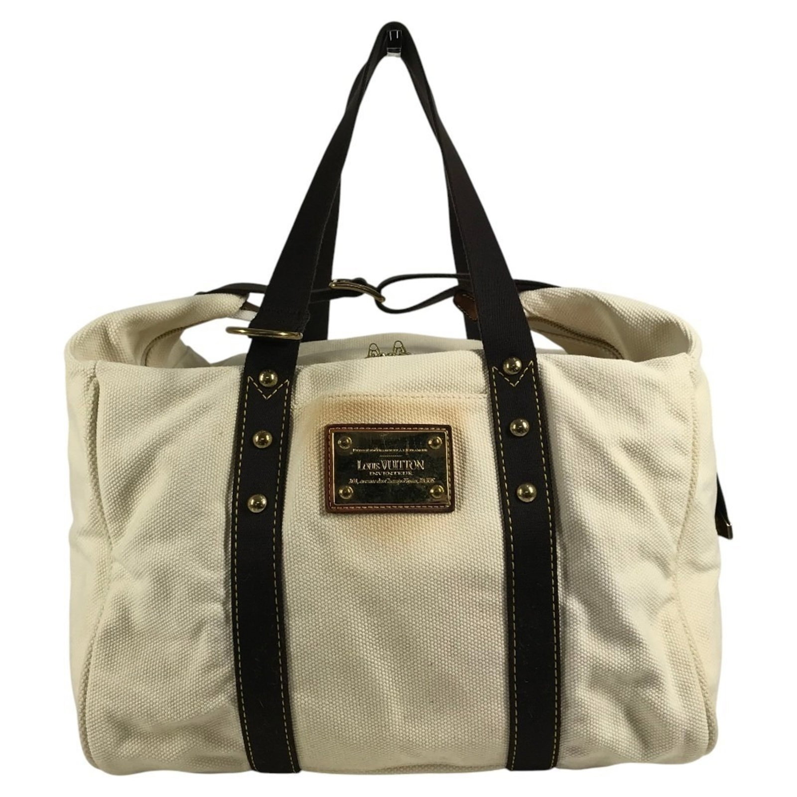 Canvas tote bag from Louis Vuitton: Canvas tote bag from Louis Vuitton Canvas tote bag from Louis Vuitton, featuring the iconic monogram pattern in brown, ecru, and white. This stylish shoulder bag measures 35cm x 35.5cm x 14cm,