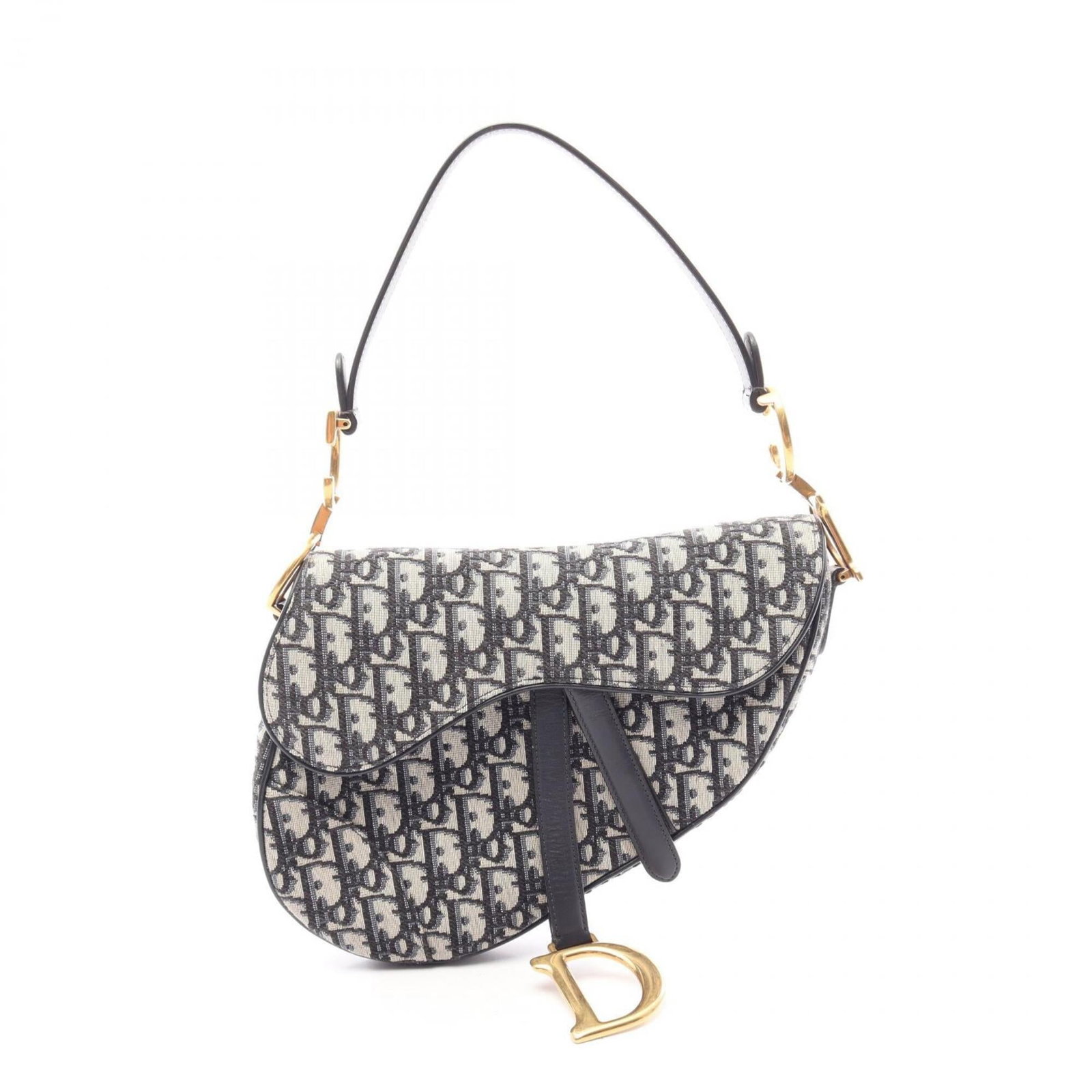 Canvas saddle bag by Christian Dior: Canvas saddle bag by Christian Dior Canvas saddle bag by Christian Dior, featuring a classic beige and navy color combination. This stylish handbag measures 17cm x 24cm x 6cm and boasts a canvas mater