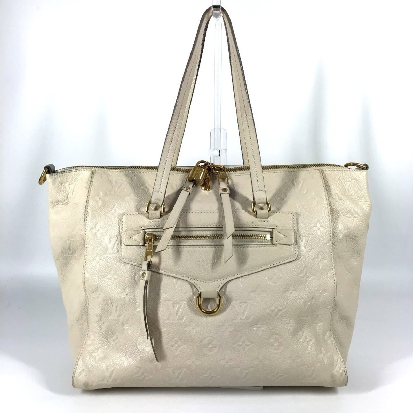 Shoulder Bag Empreinte Monogram Leather Tote Vuitton Louis: Shoulder Bag Empreinte Monogram Leather Tote Vuitton Louis Monogram Empreinte leather tote bag from Louis Vuitton, featuring the iconic Neige color. This shoulder bag measures 28cm x 33.5cm x 16cm