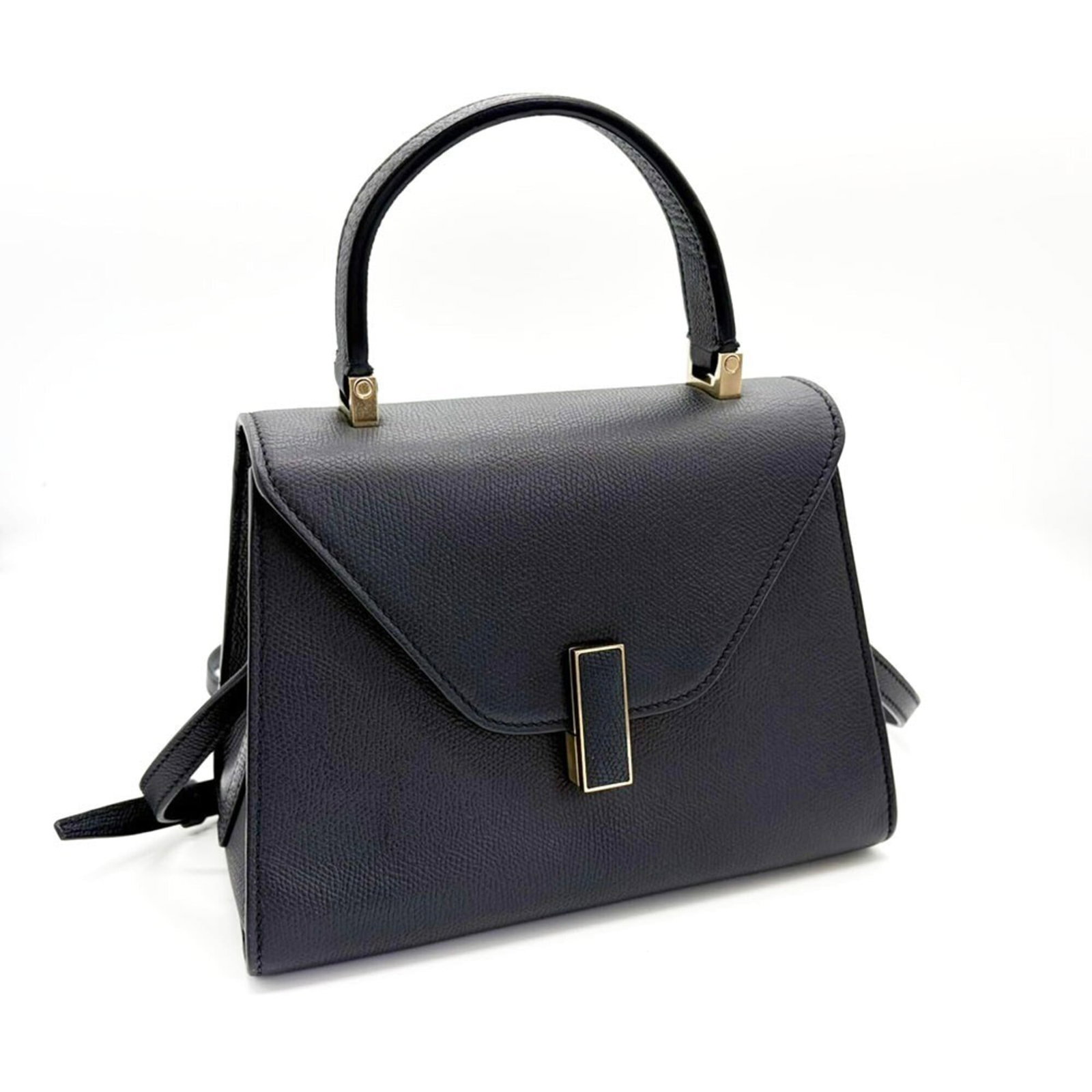 Handbag Leather Valextra: Handbag Leather Valextra Navy leather Valextra handbag with clean lines and classic design, measuring 16cm x 22cm x 12cm. Made from high-quality leather, this timeless piece boasts a sleek silhouette