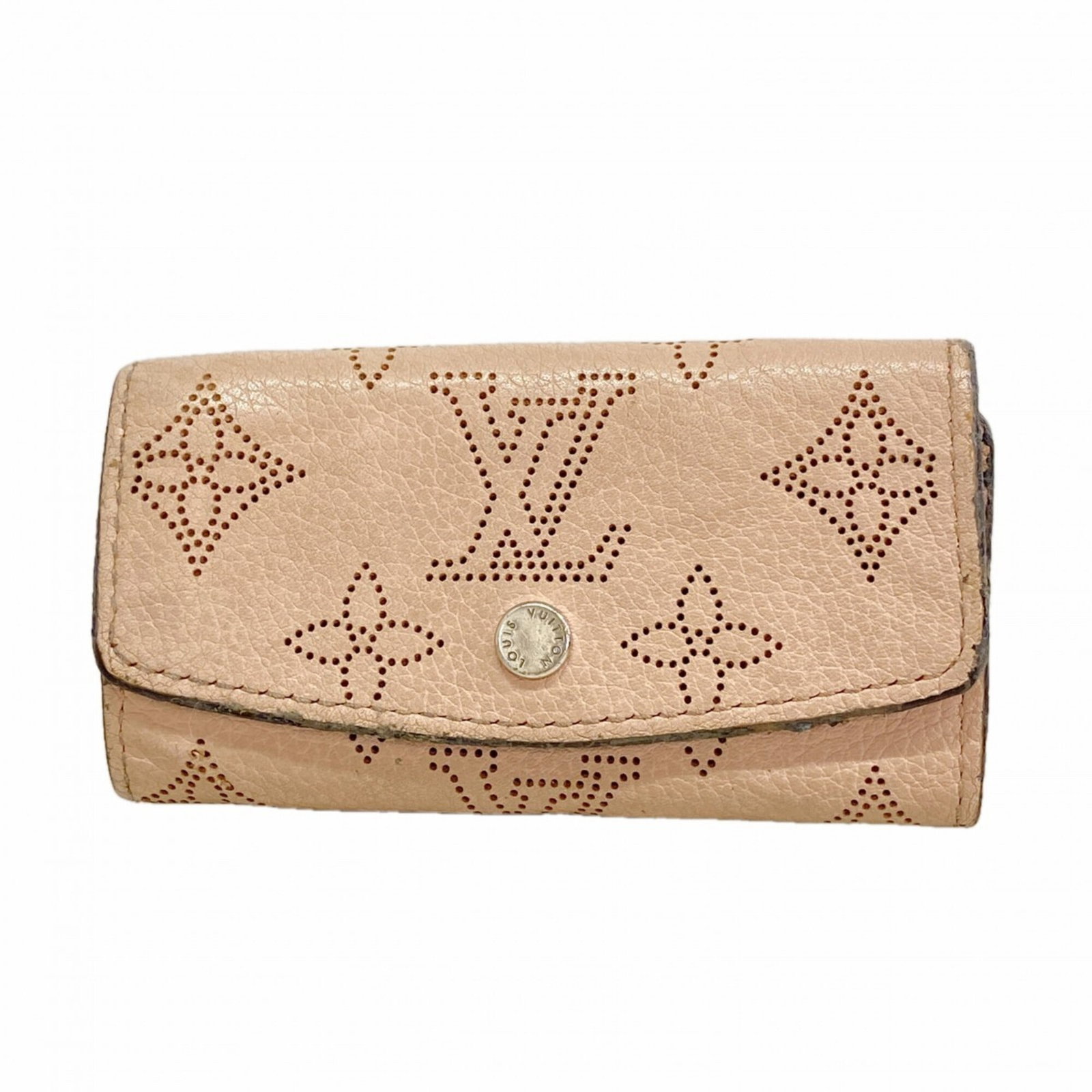 Keycase by Louis Vuitton: Keycase by Louis Vuitton Magnolia-colored Louis Vuitton keycase, measuring 6cm x 10cm x 1.5cm in size, adds a touch of elegance to any keys collection with its classic design and signature monogram