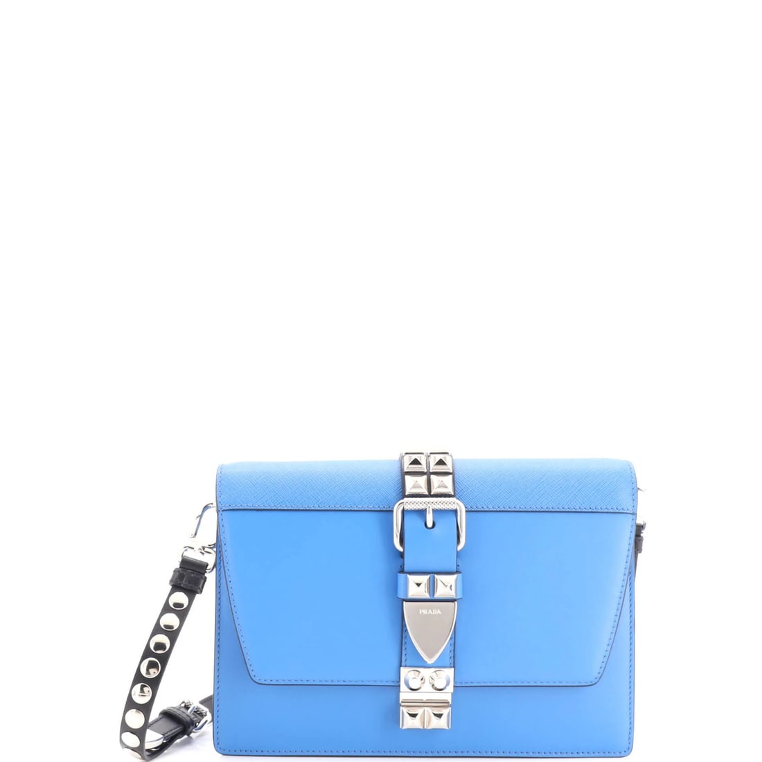 Small leather shoulder bag studded by Prada: Small leather shoulder bag studded by Prada Small leather shoulder bag studded by Prada, featuring a striking blue exterior with intricate details. With its classic cross-body design and silver