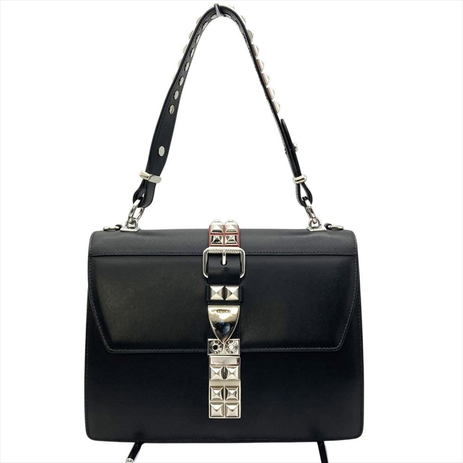 Shoulder Bag Leather by Prada: Shoulder Bag Leather by Prada Black leather shoulder bag by Prada, featuring silver hardware and a classic flap closure. Measuring 18.5cm x 26cm x 12cm, it has a 90cm strap length and a handle drop