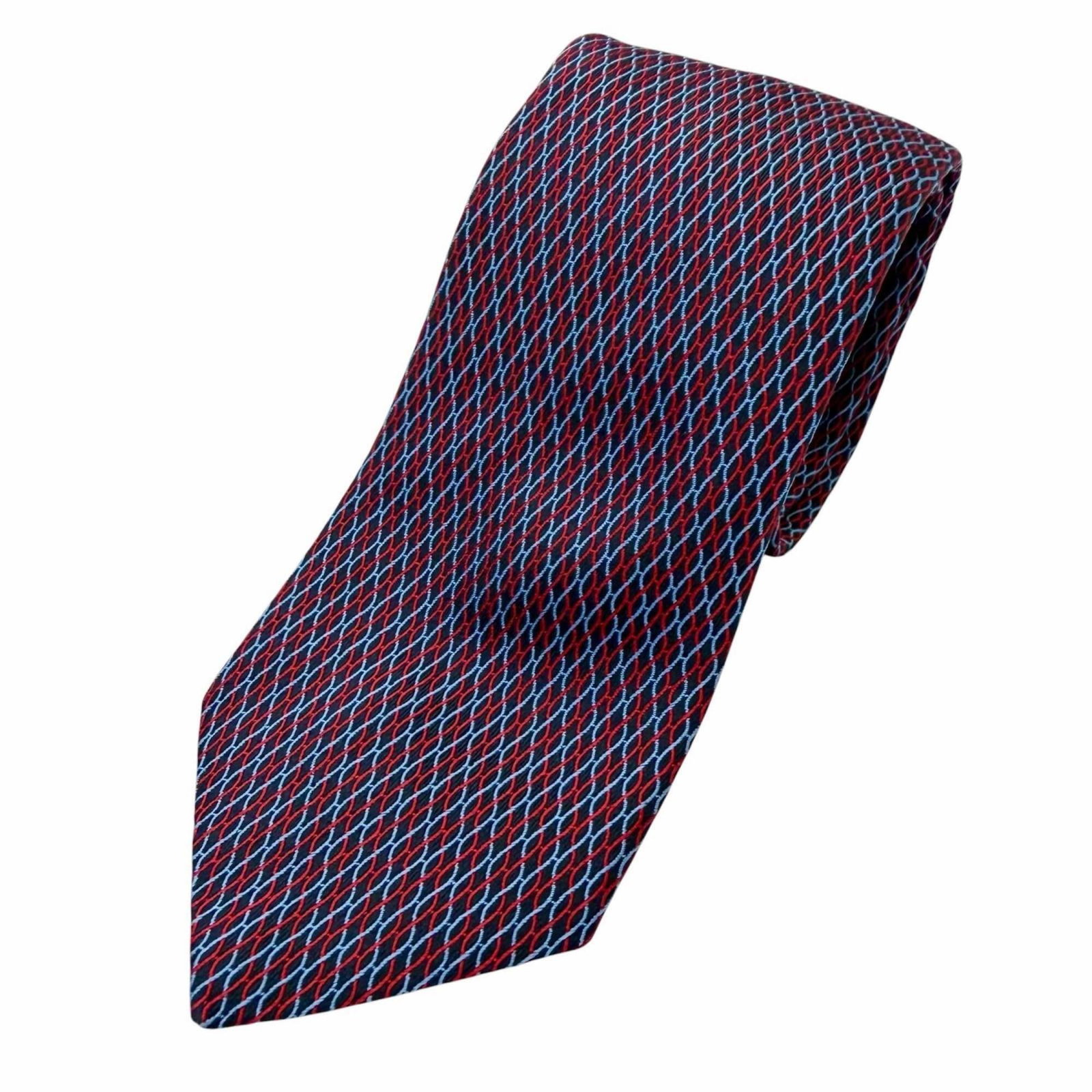Hermes Cravat Silk: Hermes Cravat Silk Silk cravat from renowned French fashion house Hermes, featuring a classic navy and red color combination. Made from high-quality silk with precise measurements at 146cm in length a
