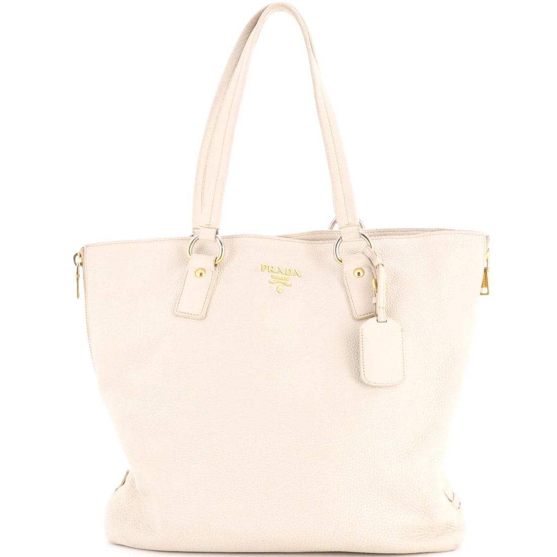Prada Side Zip Shopper Tote Vitello Daino Large: Prada Side Zip Shopper Tote Vitello Daino Large The Prada Side Zip Shopper Tote Vitello Daino Large offers a neutral and sophisticated design, featuring a large size with gold hardware. With its