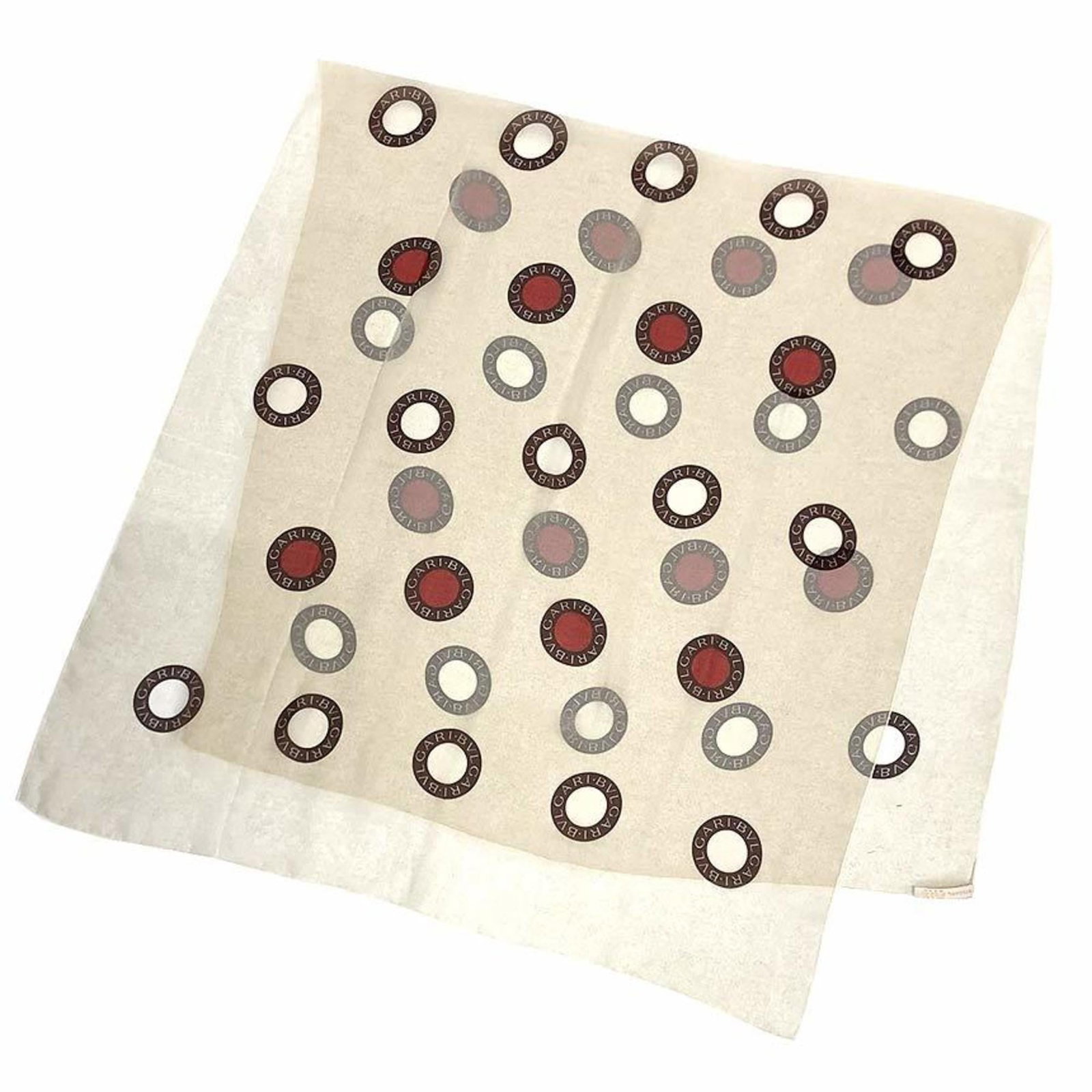 Bvlgari Scarf Silk: Bvlgari Scarf Silk Silk scarf from Bvlgari, crafted in Italy, features a striking beige and red color combination. Made from high-quality silk, the scarf measures 82cm x 1.74m, offering a luxurious to
