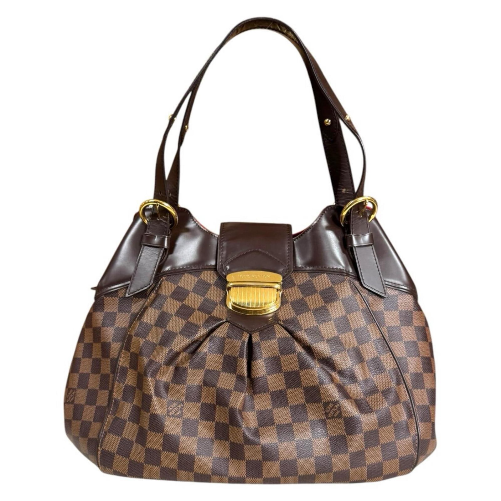 Shoulder Bag Damier Canvas by Louis Vuitton: Shoulder Bag Damier Canvas by Louis Vuitton Damier Canvas by Louis Vuitton - A Timeless Brown Shoulder Bag. This handcrafted shoulder bag features the iconic Damier canvas design, a signature element