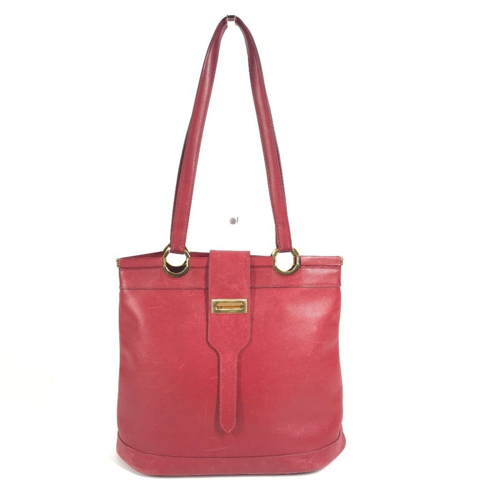 Leather tote bag Courchevel by Hermes: Leather tote bag Courchevel by Hermes Courchevel leather tote bag by Hermes, crafted in France with a striking red color and gold hardware, boasts a classic design that exudes timeless elegance.