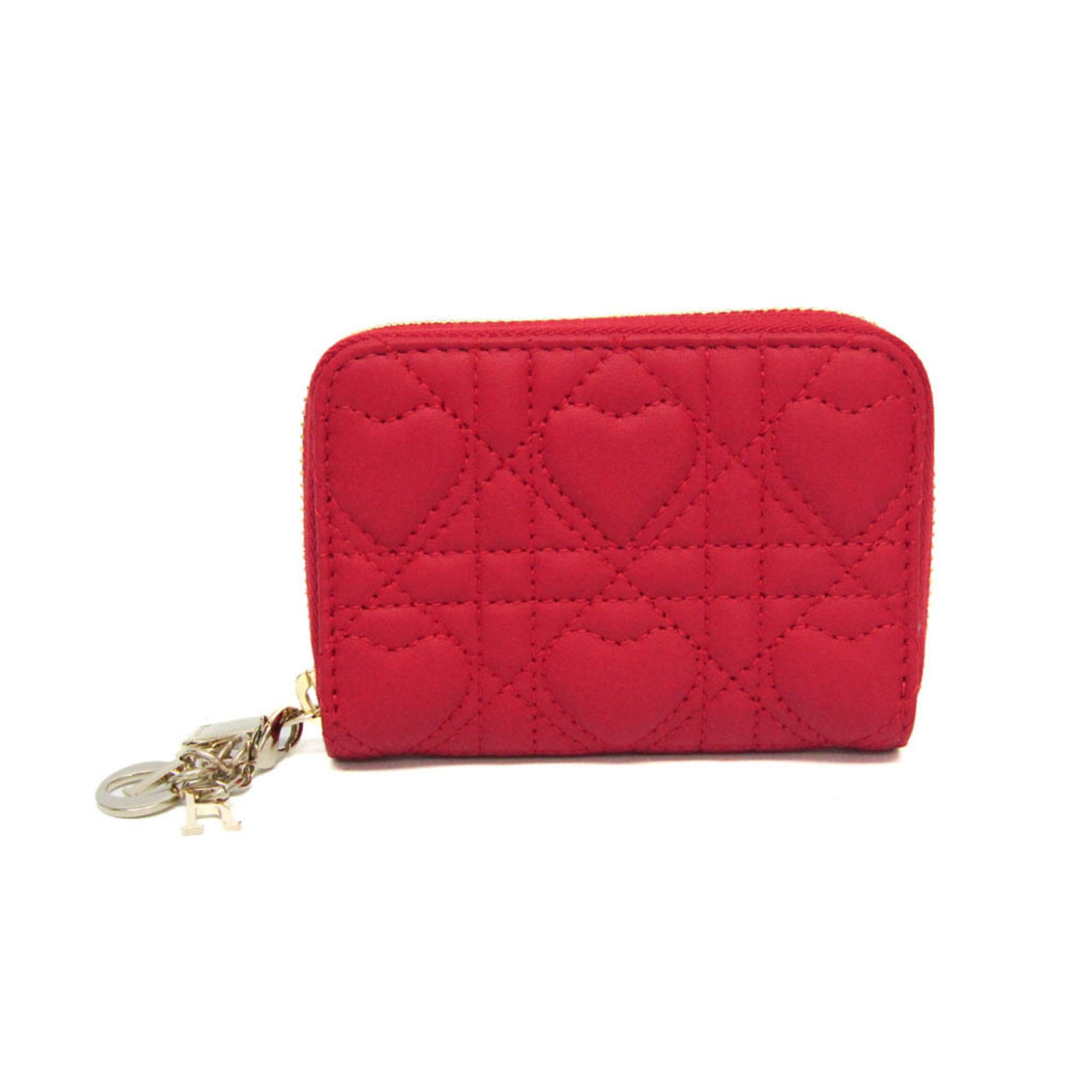 Christian Dior leather purse case: Christian Dior leather purse case The Christian Dior Lady Dior coin purse case boasts sleek, red leather with precise dimensions and a substantial weight. This Italian-made, small yet stylish