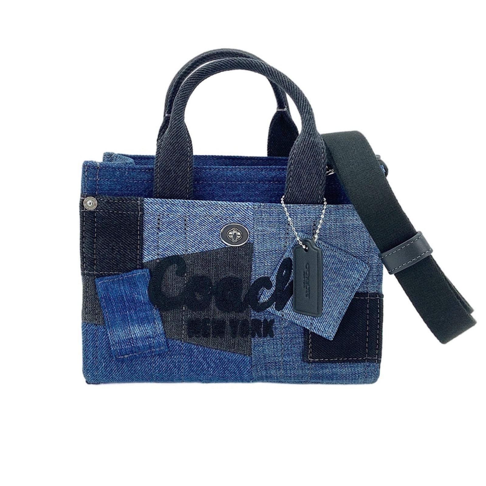 Handbag Coach Denim: Handbag Coach Denim Navy blue denim handbag from Coach, measuring 16cm x 20cm x 10cm. This stylish bag features a strap length of 120cm and a handle drop of 7.00cm, making it a versatile accessory