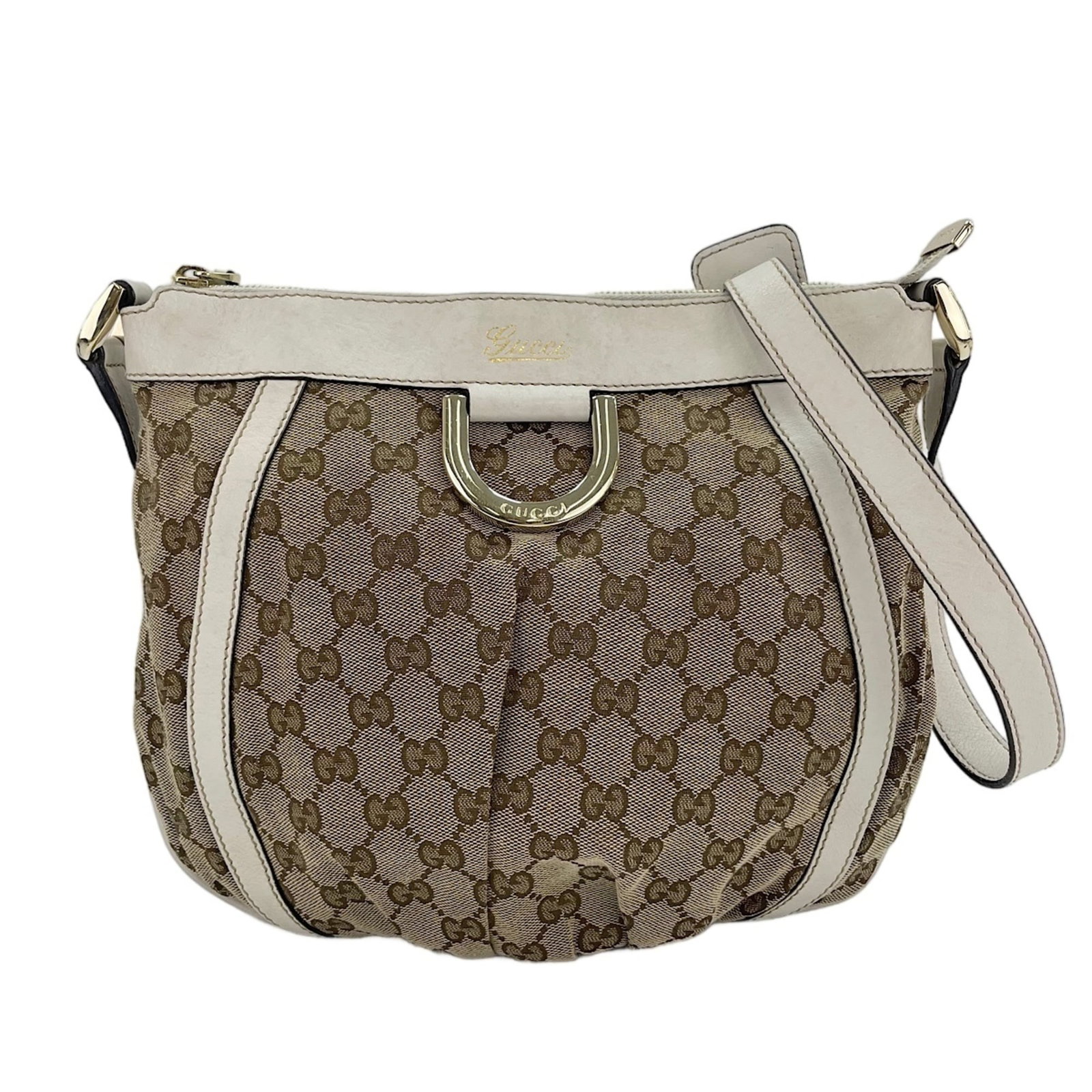 Shoulder Bag Gucci: Shoulder Bag Gucci The Gucci Abbey shoulder bag boasts a timeless beige color and sleek design, making it a versatile accessory for everyday use. With its spacious interior and adjustable strap