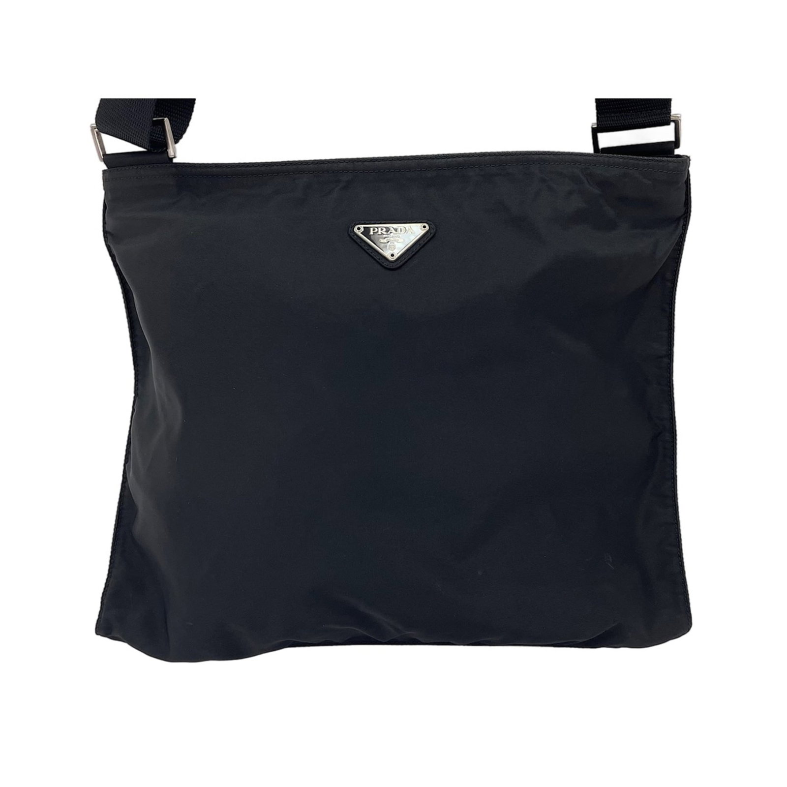 Shoulder Bag Nylon Prada: Shoulder Bag Nylon Prada Black Prada nylon shoulder bag with clean lines and minimal design. Made from durable nylon, this bag measures 30cm x 34cm x 1cm and features a sleek black color. A stylish