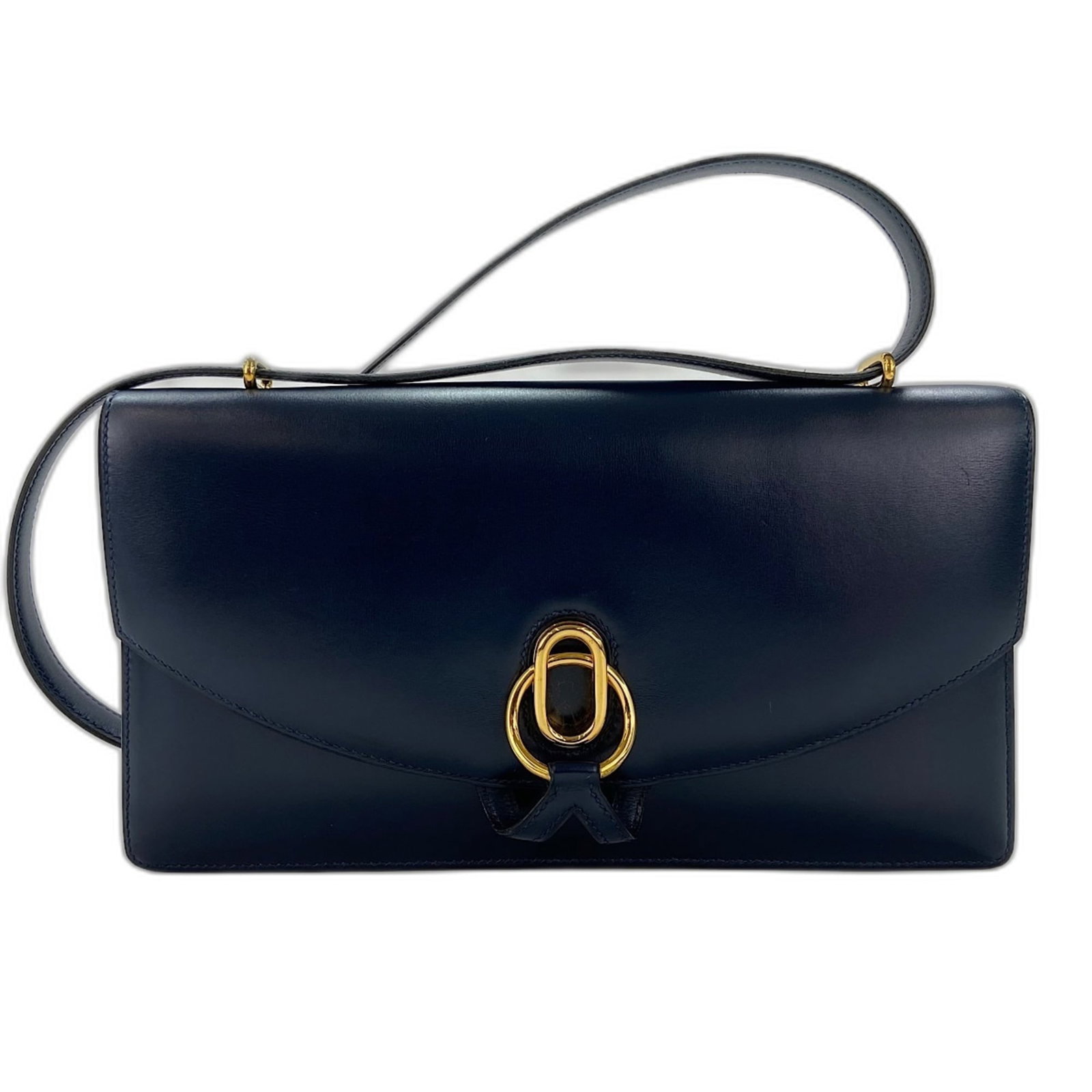 Calf leather bag box shoulder bag Hermes: Calf leather bag box shoulder bag Hermes Box calf leather construction and navy color make this Hermes shoulder bag a stylish and elegant accessory. Measuring 15cm x 27cm x 4cm, it features a classic 