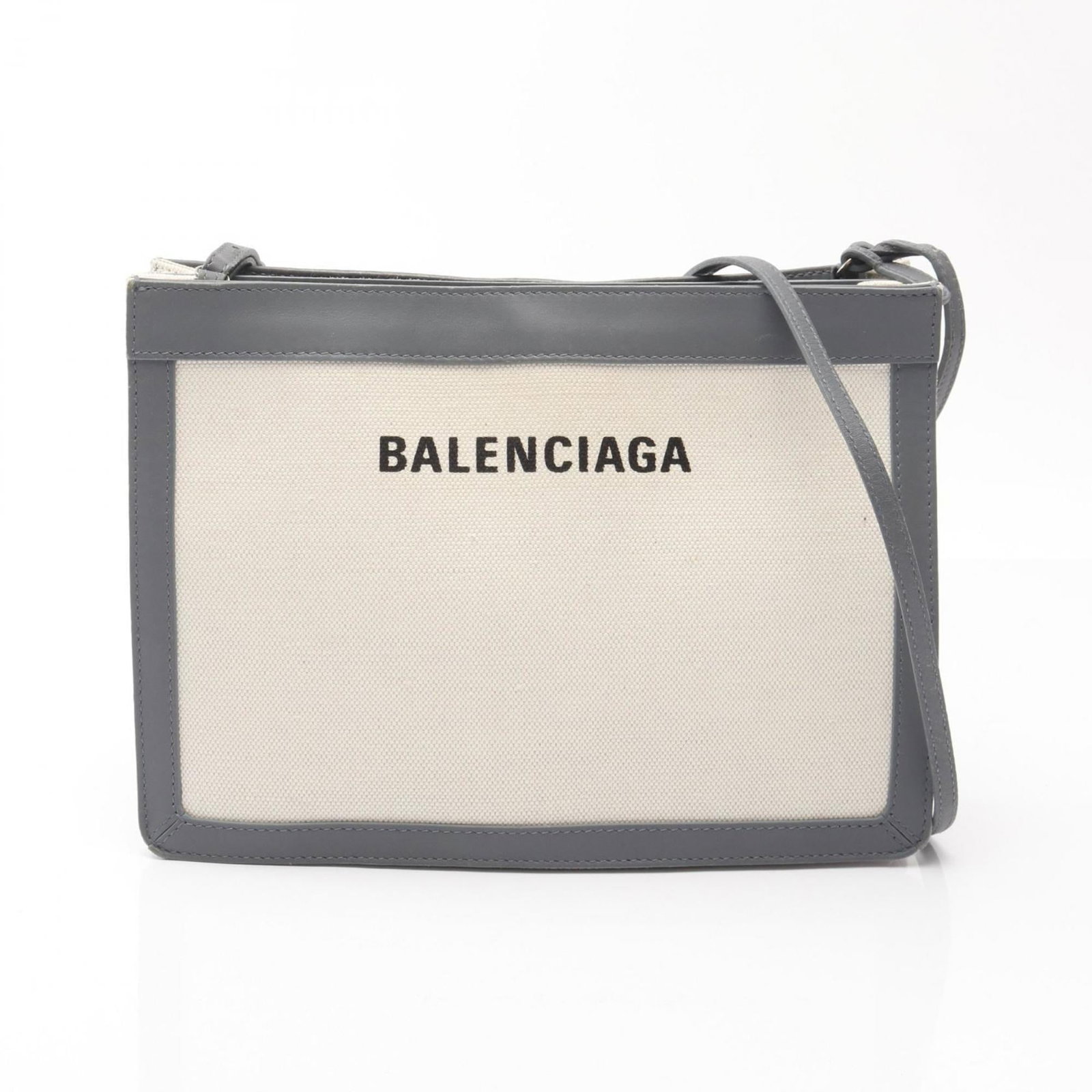 Canvas shoulder bag leather pochette by Balenciaga: Canvas shoulder bag leather pochette by Balenciaga Canvas shoulder bag leather pochette by Balenciaga, featuring a stylish canvas and leather combination in gray and ivory hues. This versatile