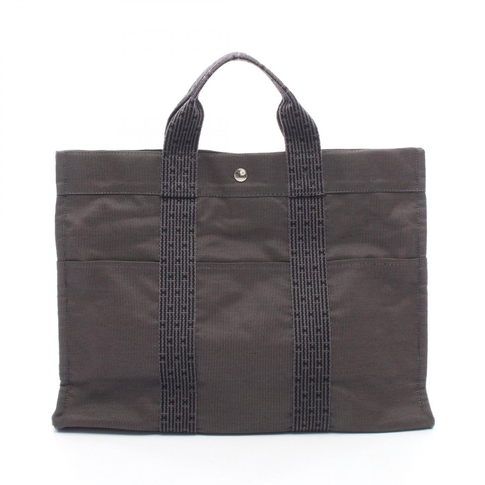 Handbag Tote Bag of Canvas by Hermes: Handbag Tote Bag of Canvas by Hermes Canvas by Hermes Handbag Tote Bag - A Timeless Gray Classic. Made from high-quality canvas, this iconic tote bag features a sleek gray color and dimensions that