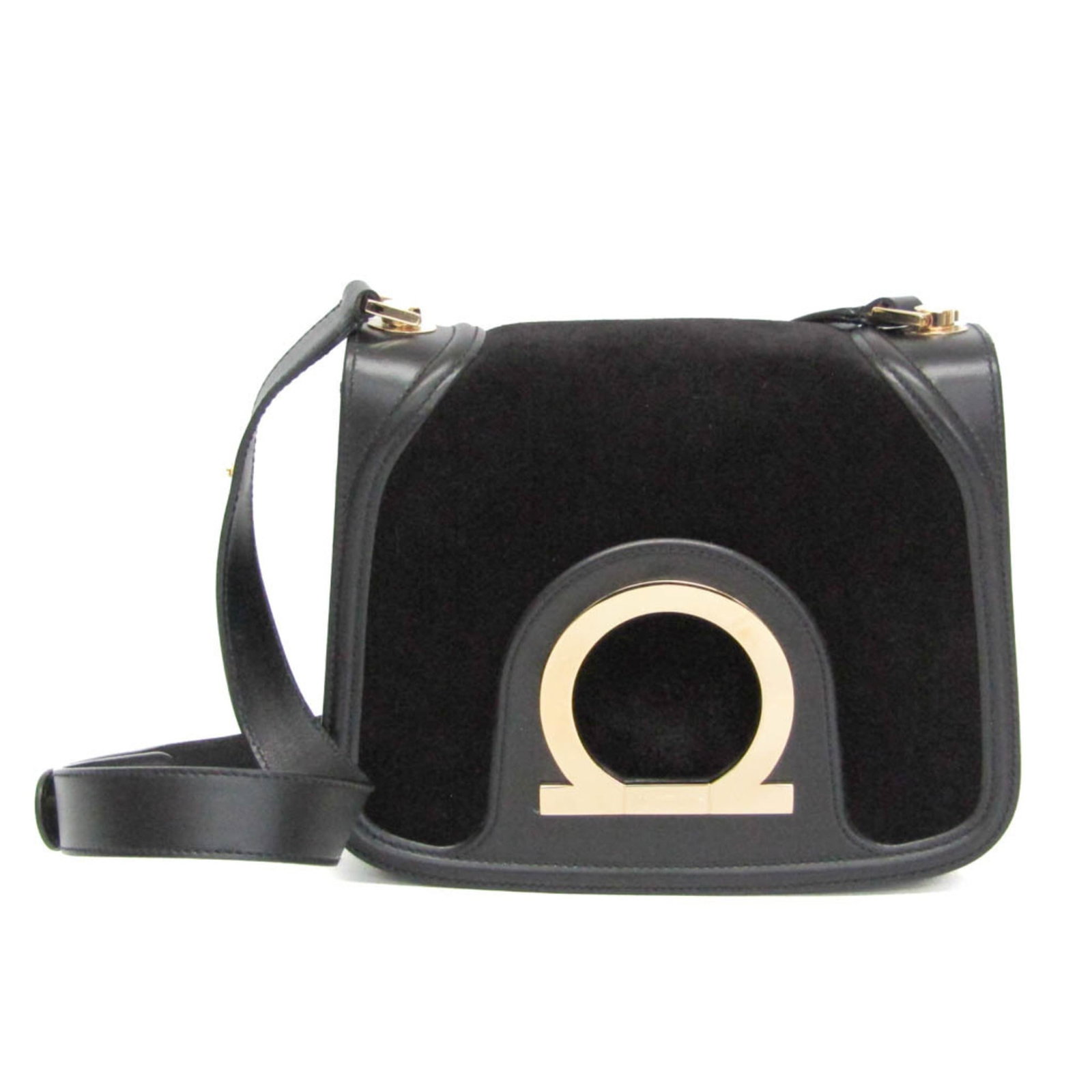Ferragamo Leather Suede Bag Shoulder: Ferragamo Leather Suede Bag Shoulder Black leather and suede shoulder bag from the Salvatore Ferragamo Gancini line, featuring a magnetic snap closure, zipper pocket, and adjustable strap length.