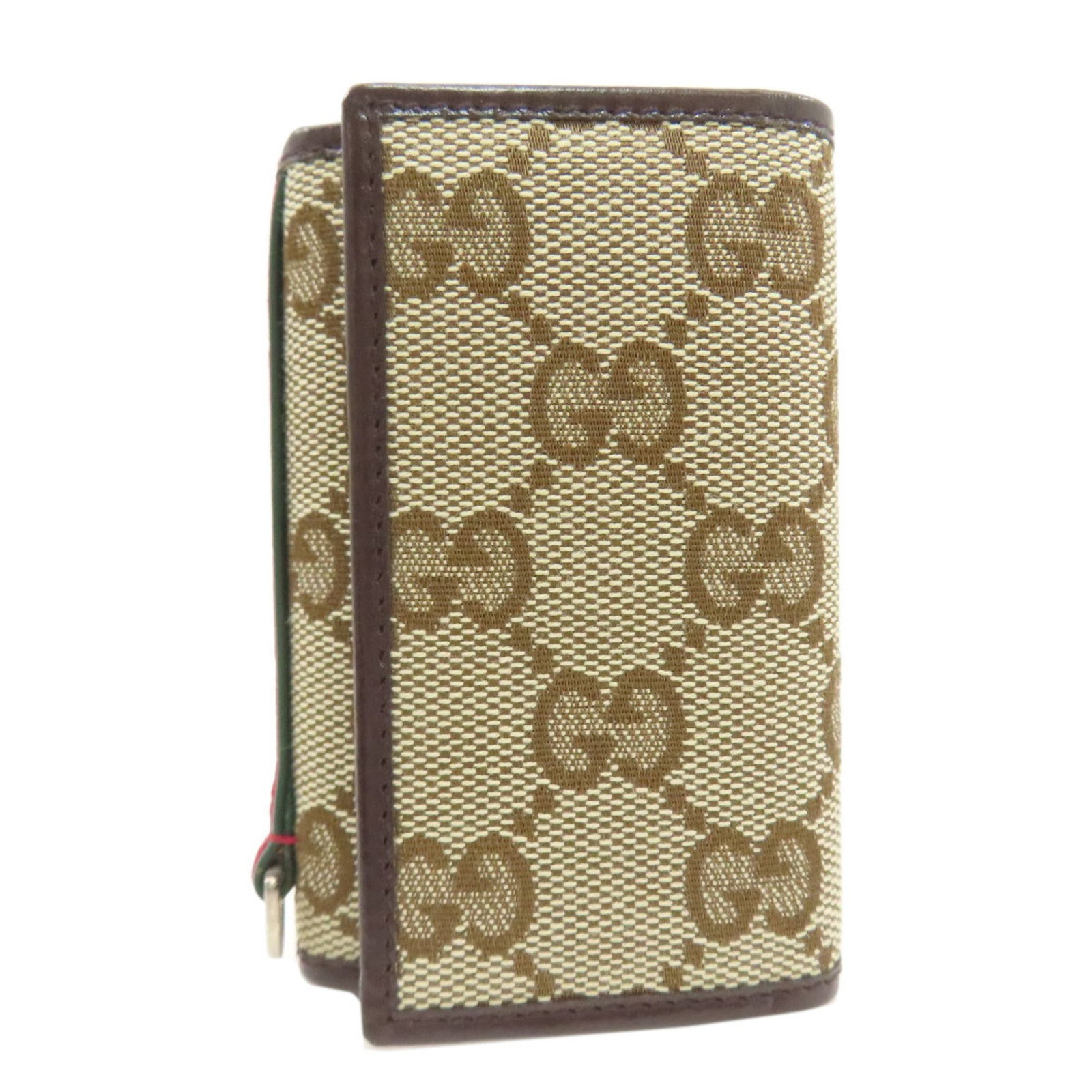 Keycase Canvas of Gucci: Keycase Canvas of Gucci Canvas keycase from Gucci, featuring a classic brown design. Made from high-quality canvas material, this compact keycase measures 9cm x 6cm x 2cm and offers a stylish way to c