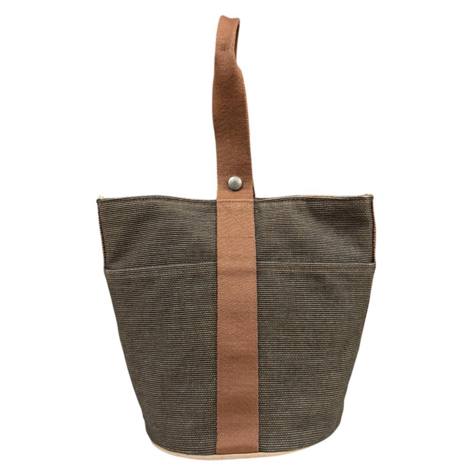 Handbag Toile By Hermes: Handbag Toile By Hermes Toile de Jouy, a classic French design, adorns the iconic Herm?s handbag in rich brown hues. Measuring 26cm x 21.5cm, this compact tote features a timeless combination of style
