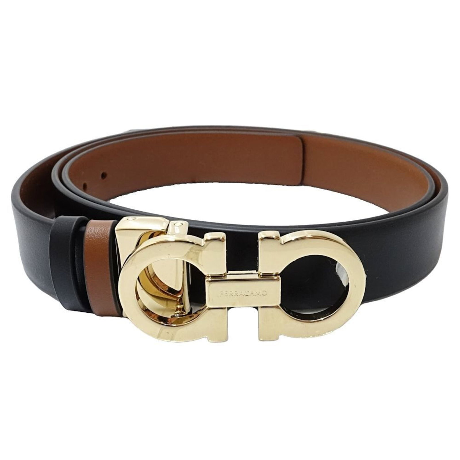 Ferragamo Standard Belt Salvatore: Ferragamo Standard Belt Salvatore Standard belt from Salvatore Ferragamo, featuring black and brown leather strap options. Made with high-quality materials, this classic design measures 99.5cm in leng