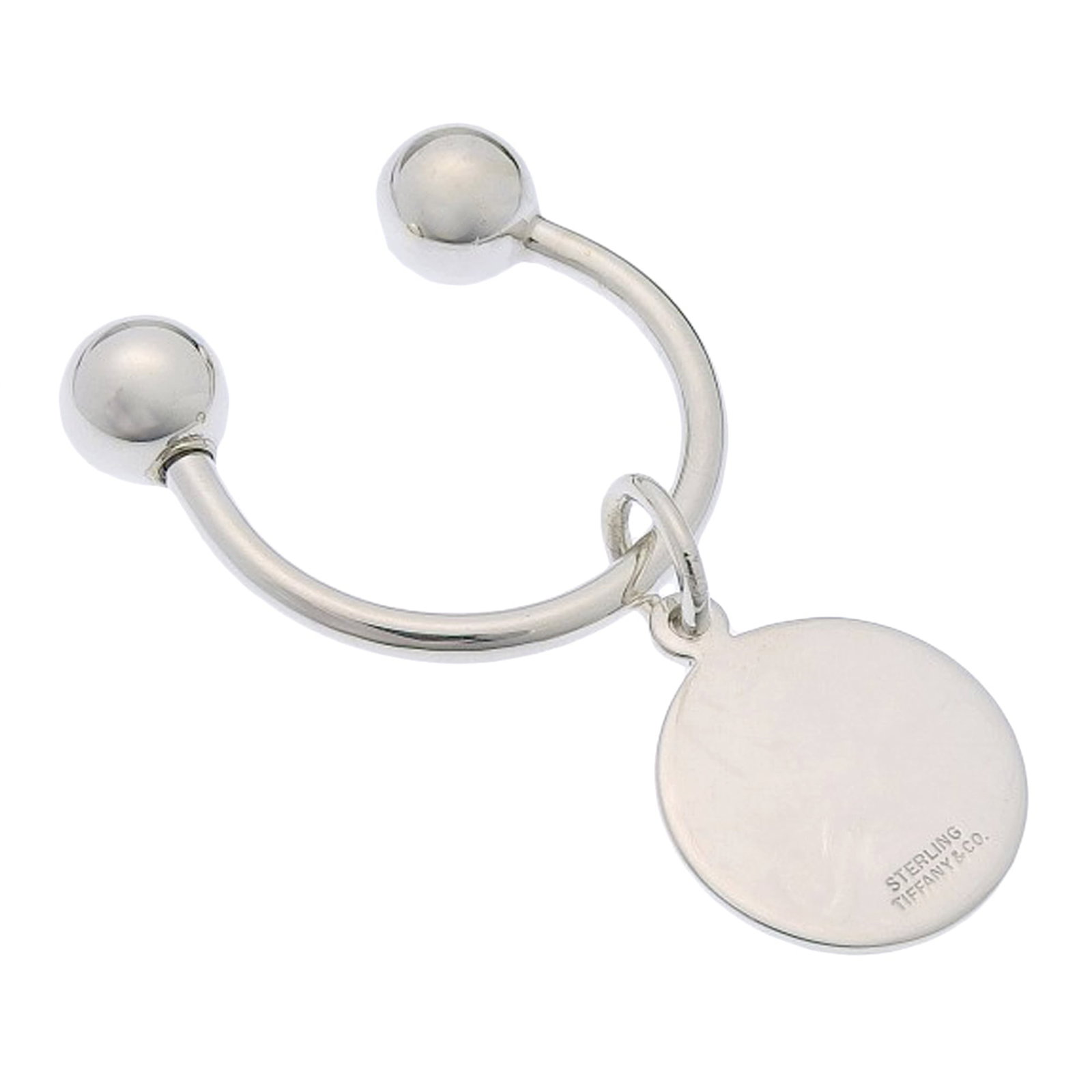 Tiffany silver keyring 925: Tiffany silver keyring 925 Silver keyring made from 925 sterling silver, bearing the Tiffany brand. This elegant accessory features a sleek design in a classic silver finish. Made from high-quality