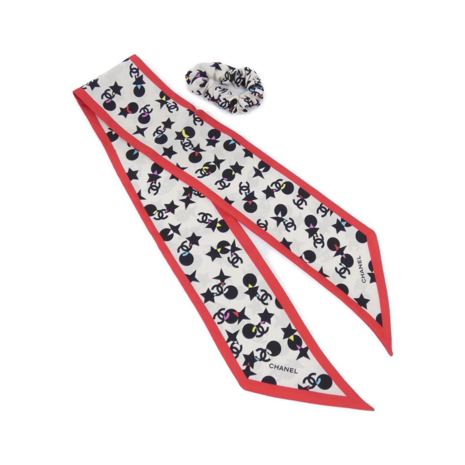 Chanel silk scrunchie: Chanel silk scrunchie Silk scrunchie from the iconic Chanel brand, available in three elegant colors: black, ivory, and red. Made from luxurious silk, this scrunchie measures 9cm x 1m, offering a styl