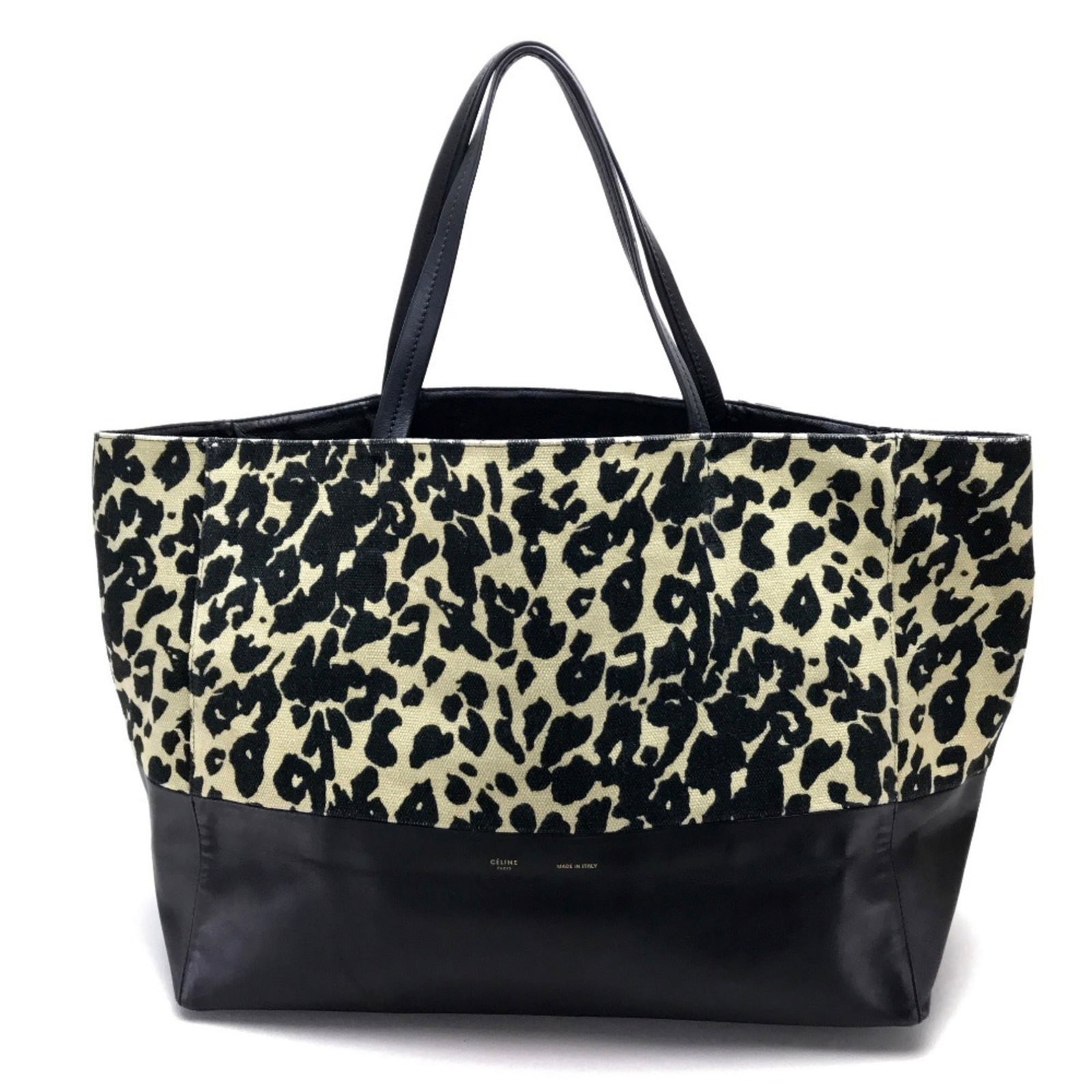 Canvas leather tote bag Celine: Canvas leather tote bag Celine Canvas and leather combine in this understated Celine tote bag, available in beige and black. The bag's canvas material provides a natural look, while the leather