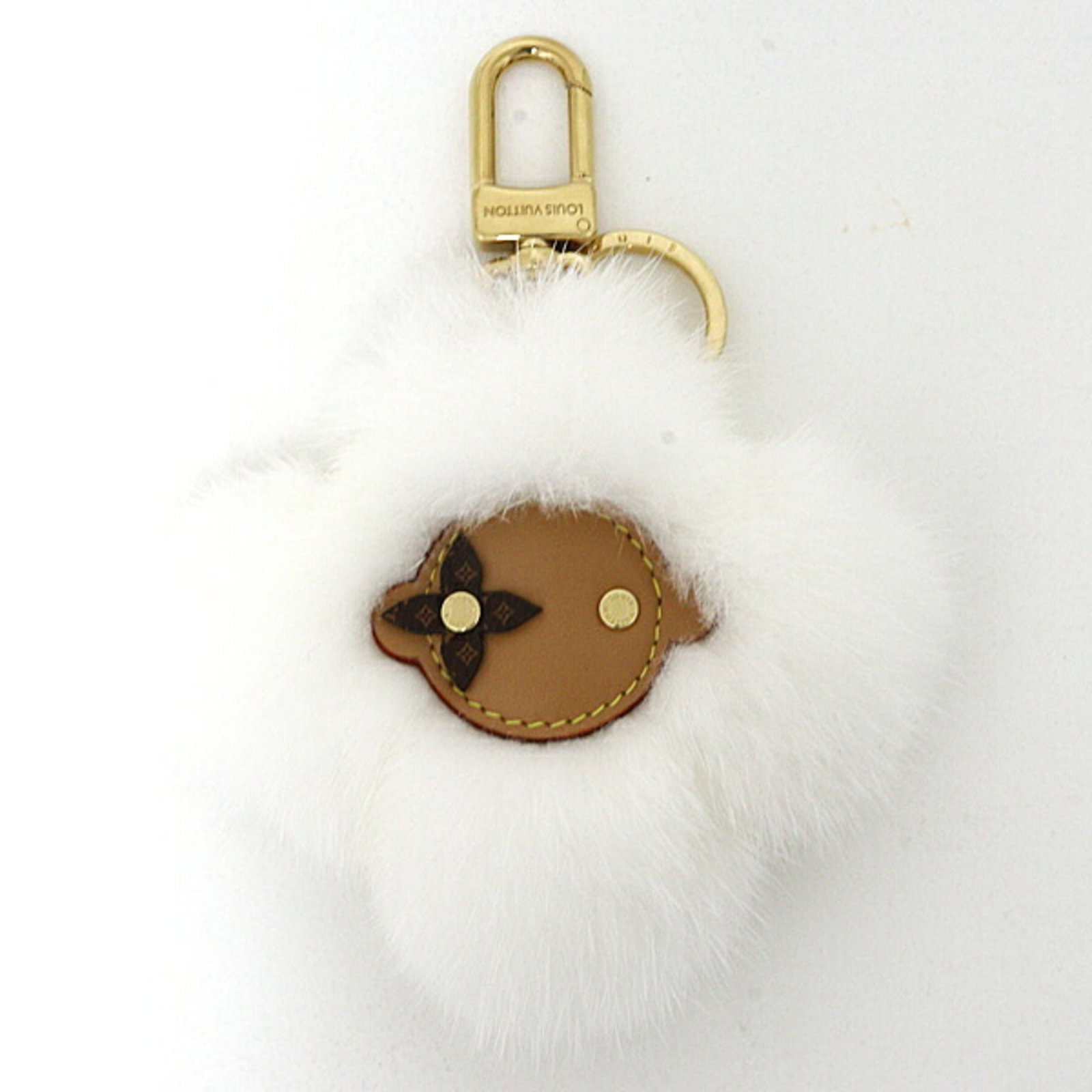 Fur keyring from leather by Louis Vuitton: Fur keyring from leather by Louis Vuitton The Louis Vuitton fur keyring boasts a striking design, combining luxurious mink fur with supple leather. Measuring 15cm x 11cm, the sleek and modern piece fe