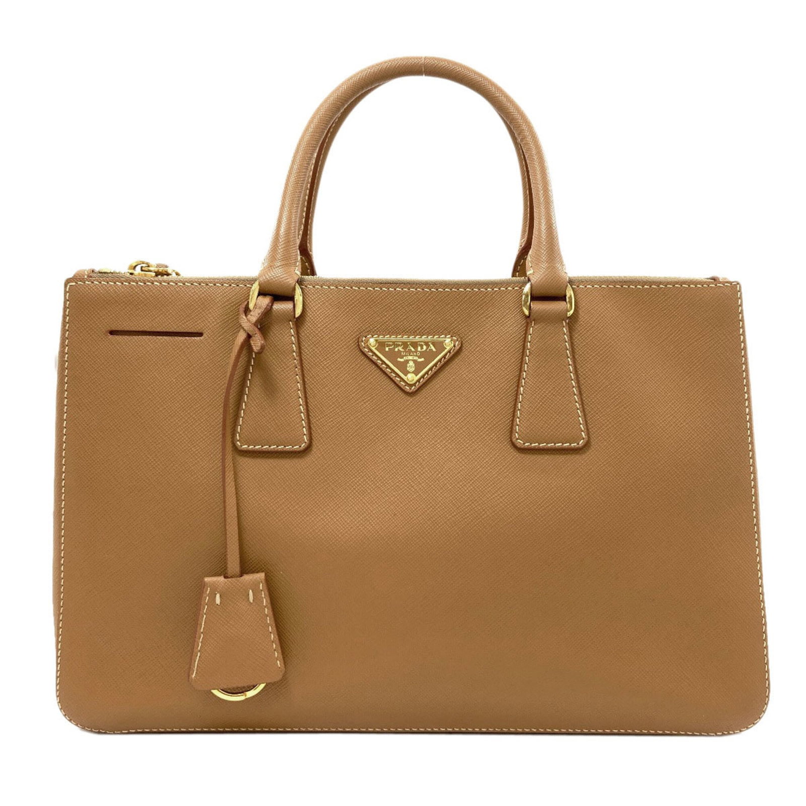 Handbag Saffiano Prada Triangle: Handbag Saffiano Prada Triangle Saffiano Prada Triangle Handbag, Brown. This Saffiano triangle handbag features a classic design with clean lines and a timeless aesthetic. Measuring 20cm x 30cm x