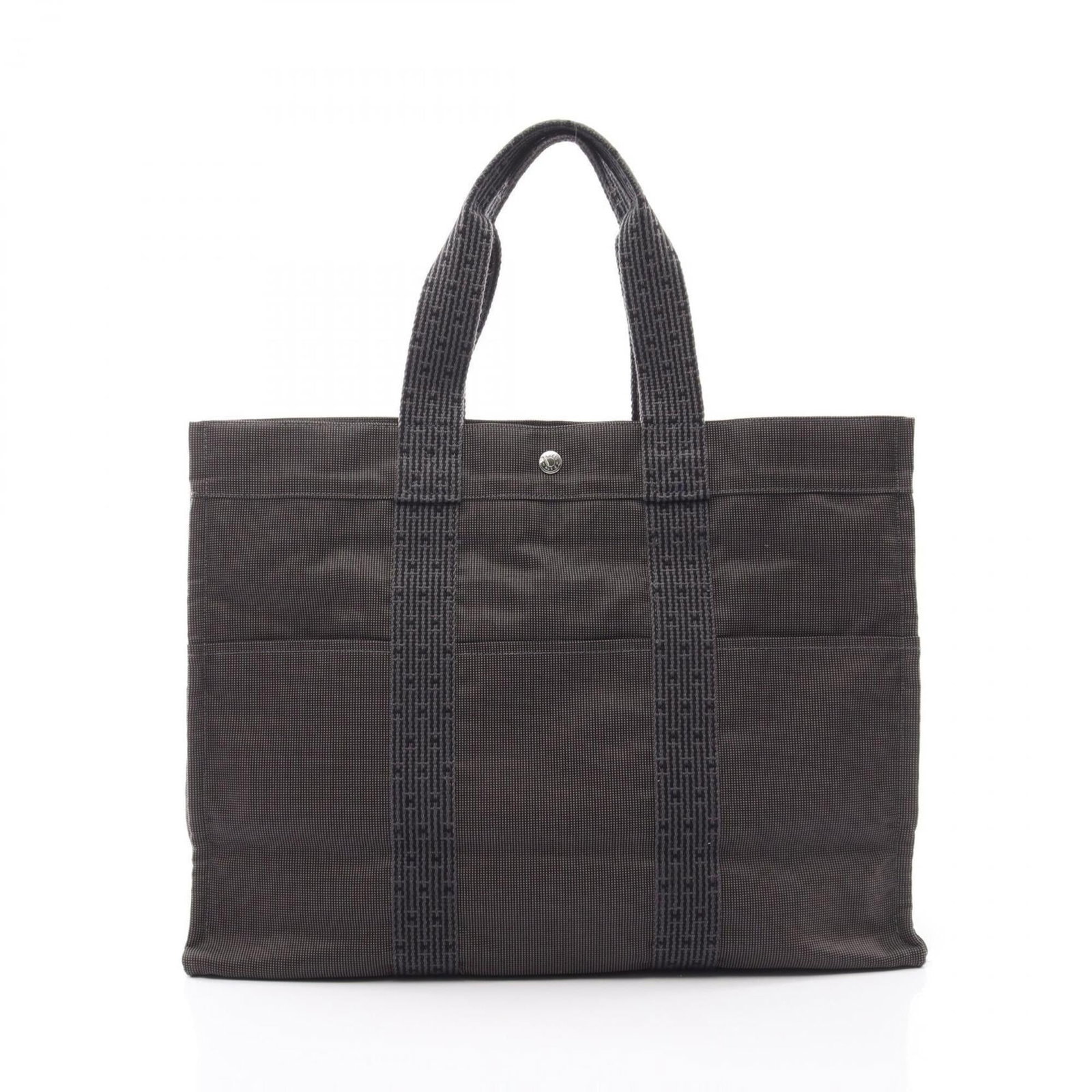 Handbag Tote Bag of Canvas by Hermes: Handbag Tote Bag of Canvas by Hermes Canvas tote bag by Hermes features a gray color and measures 35cm x 46cm x 15cm. This canvas handbag is made from high-quality material, with a classic design that