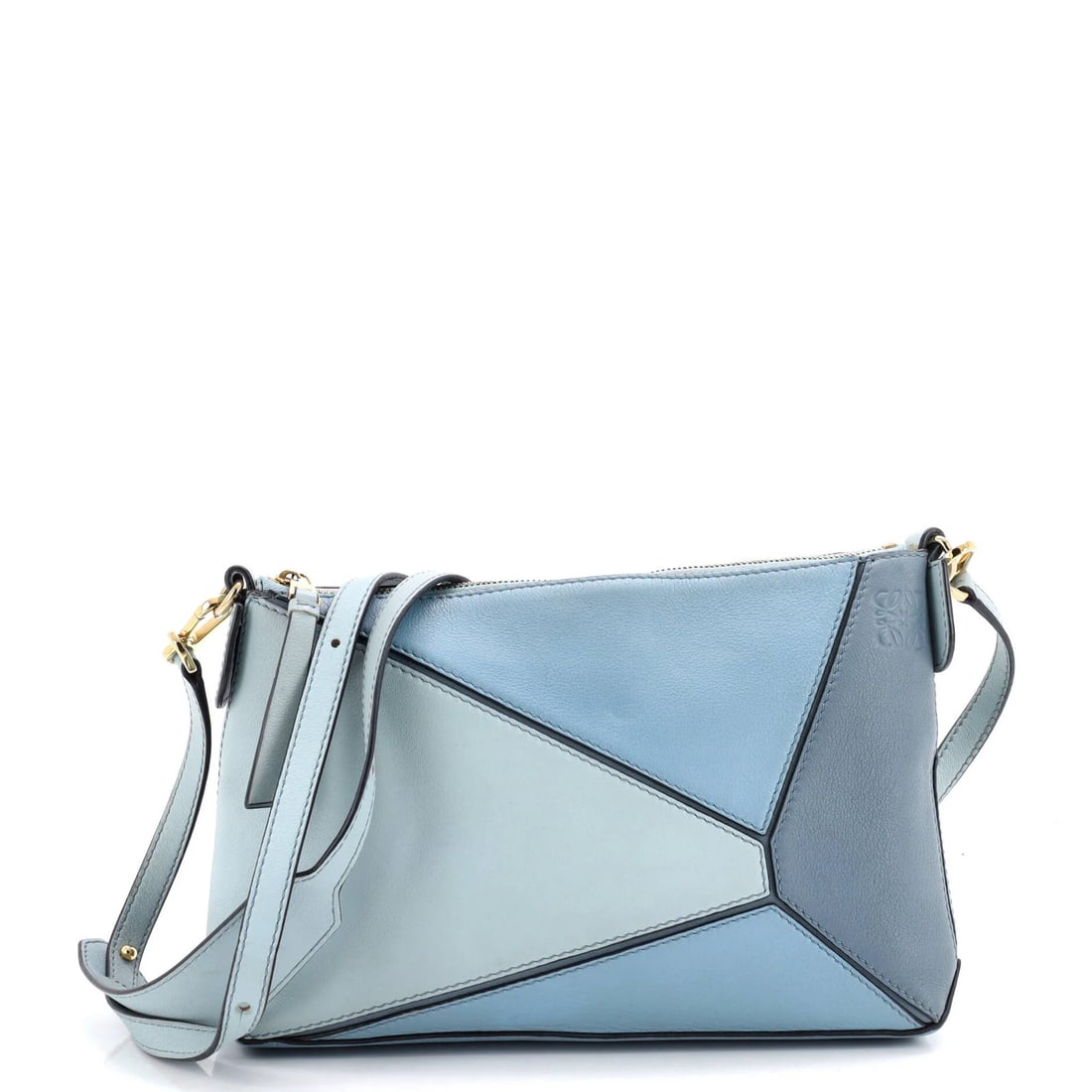 Loewe Puzzle Pochette Leather Small Bag: Loewe Puzzle Pochette Leather Small Bag The Loewe Puzzle Pochette Leather Small Bag boasts a sleek, blue exterior with minor creases and scuffs. With its adjustable strap drop and gold hardware, this