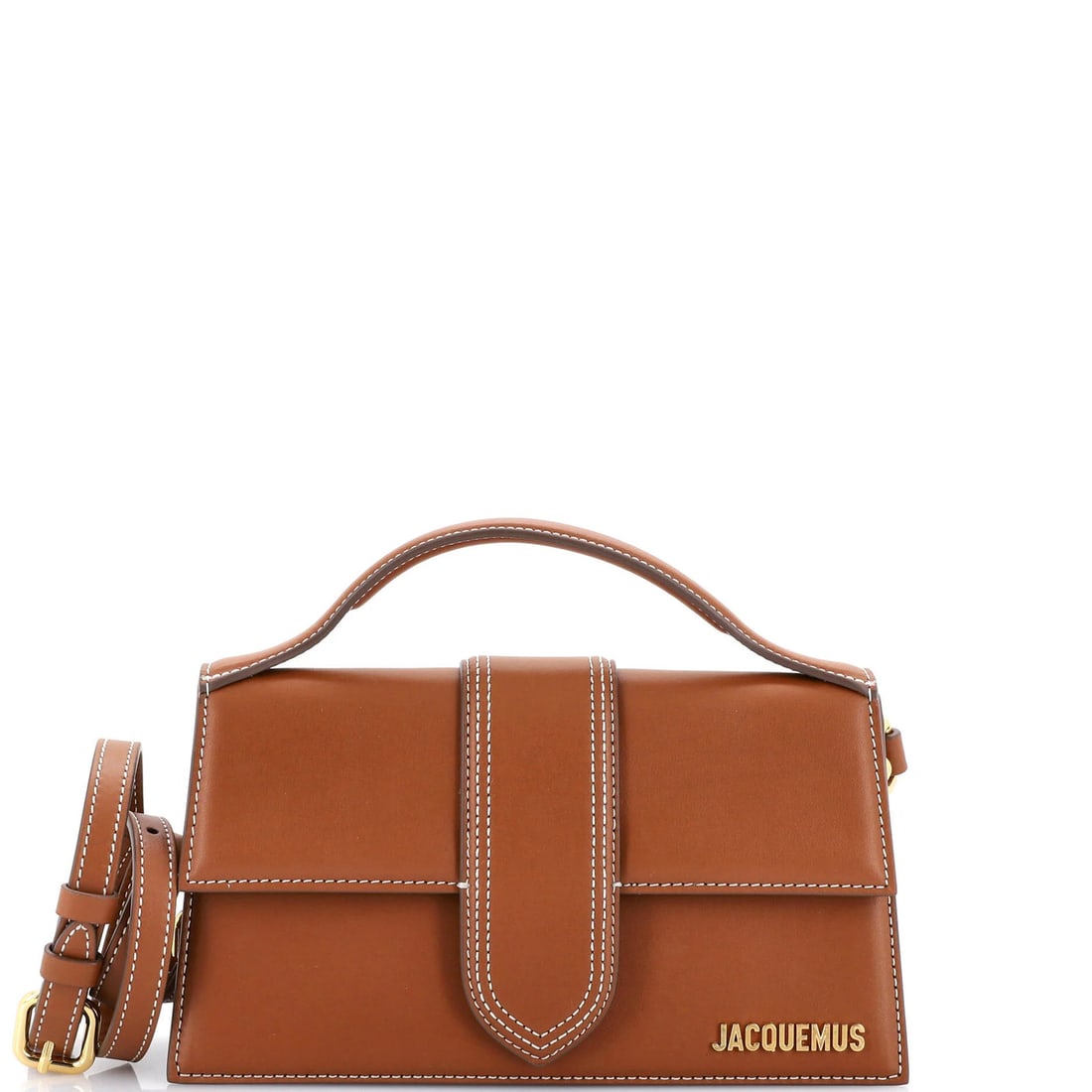 Leather flap bag bambino grand by Jacquemus: Leather flap bag bambino grand by Jacquemus Brown leather cross body bag with gold hardware, featuring a flap closure and adjustable strap. The bag has scuffs, edge wear, corner wear, minor creases