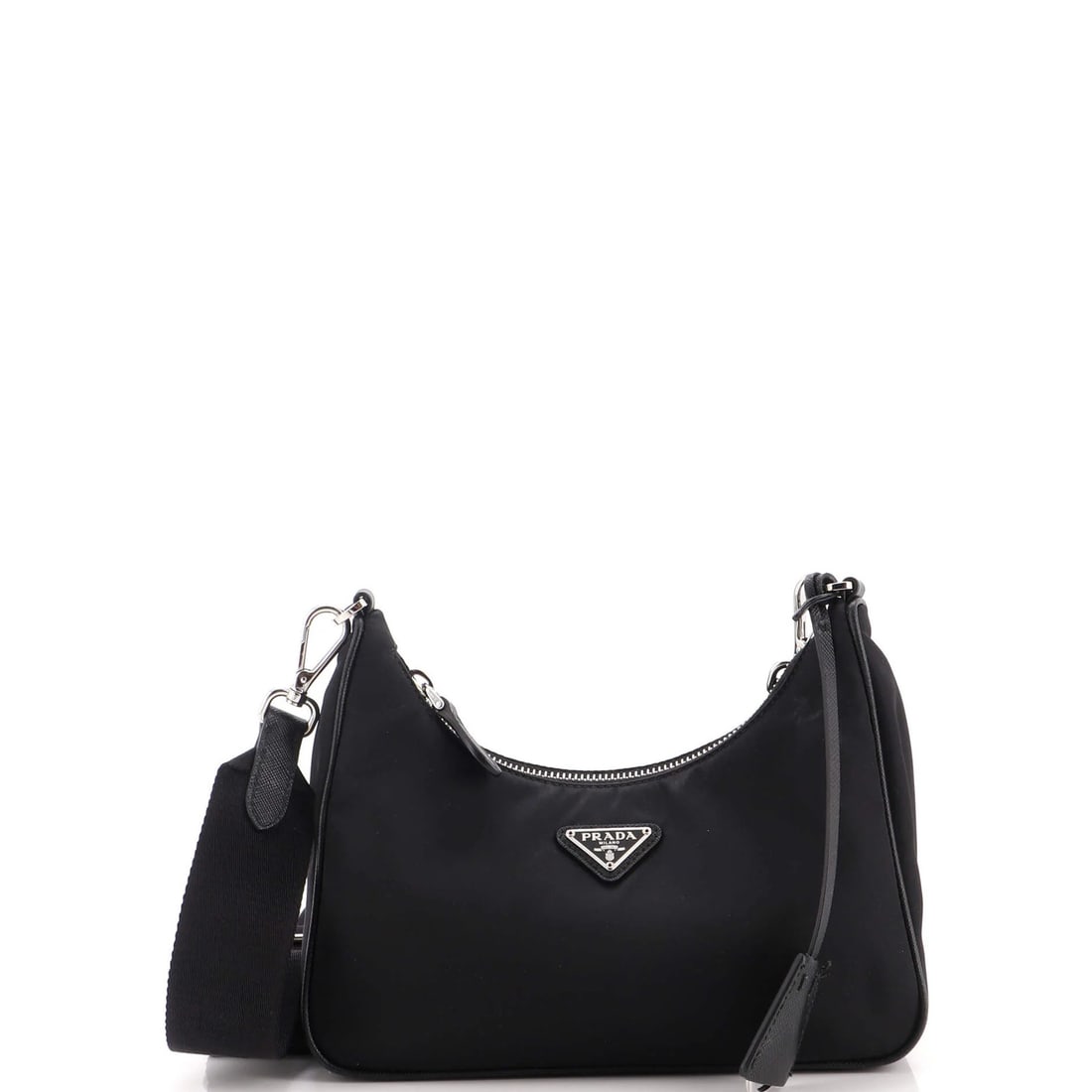Small bag Tessuto shoulder Re-Edition Prada 2005: Small bag Tessuto shoulder Re-Edition Prada 2005 Small bag with Tessuto fabric exterior, featuring a classic cross body design. Made from nylon and measuring 5" tall, 8.5" wide, and 3" deep, this
