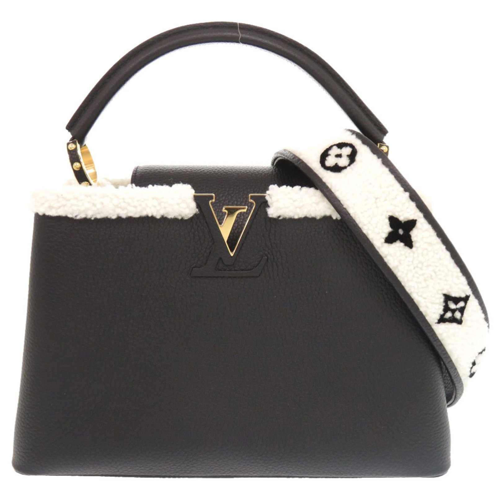 Louis Vuitton Handbag Leather: Louis Vuitton Handbag Leather Taurillon leather, a signature Louis Vuitton material, adorns this sleek black handbag from the iconic French brand. Crafted with attention to detail, its gold hardware a