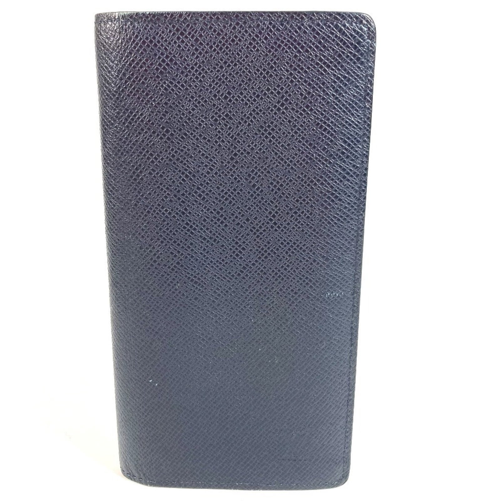 Long Wallet Bi Fold Leather Taiga Louis Vuitton: Long Wallet Bi Fold Leather Taiga Louis Vuitton Taiga leather, blue in color, provides a sophisticated look to this long wallet with bi-fold design. Made from high-quality materials, its 19cm x 9cm
