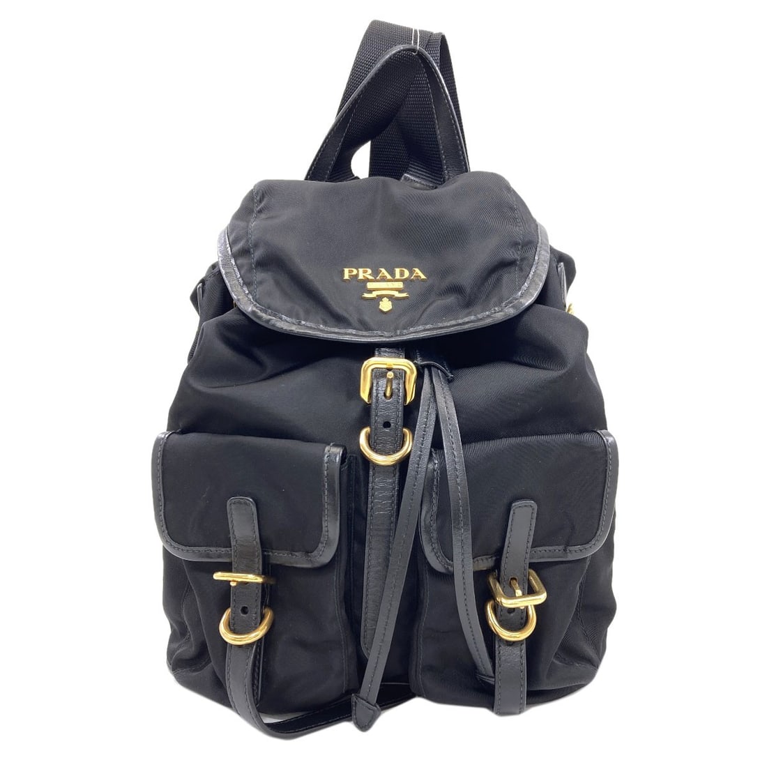 Nylon Daypack Prada Backpack: Nylon Daypack Prada Backpack Black Nylon PRADA Daypack with clean lines and a classic design, made from durable nylon exterior. The backpack's simple yet stylish aesthetic makes it a versatile accesso