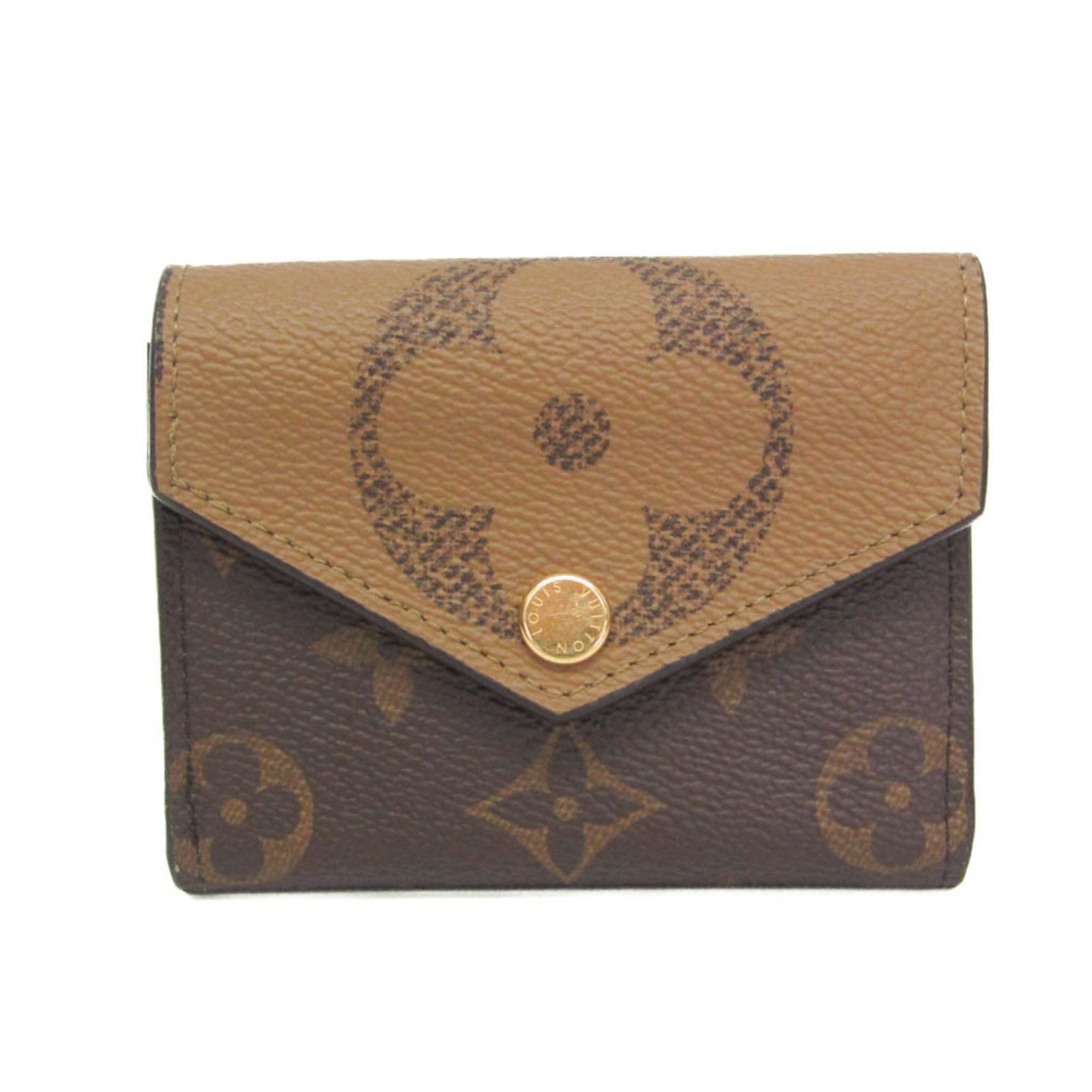 Louis Vuitton Wallet (Tri-Fold) Monogram: Louis Vuitton Wallet (Tri-Fold) Monogram Monogram Reverse Louis Vuitton Wallet features the iconic Monogram Giant pattern in reverse, adding a touch of elegance to everyday essentials. This tri-fold w