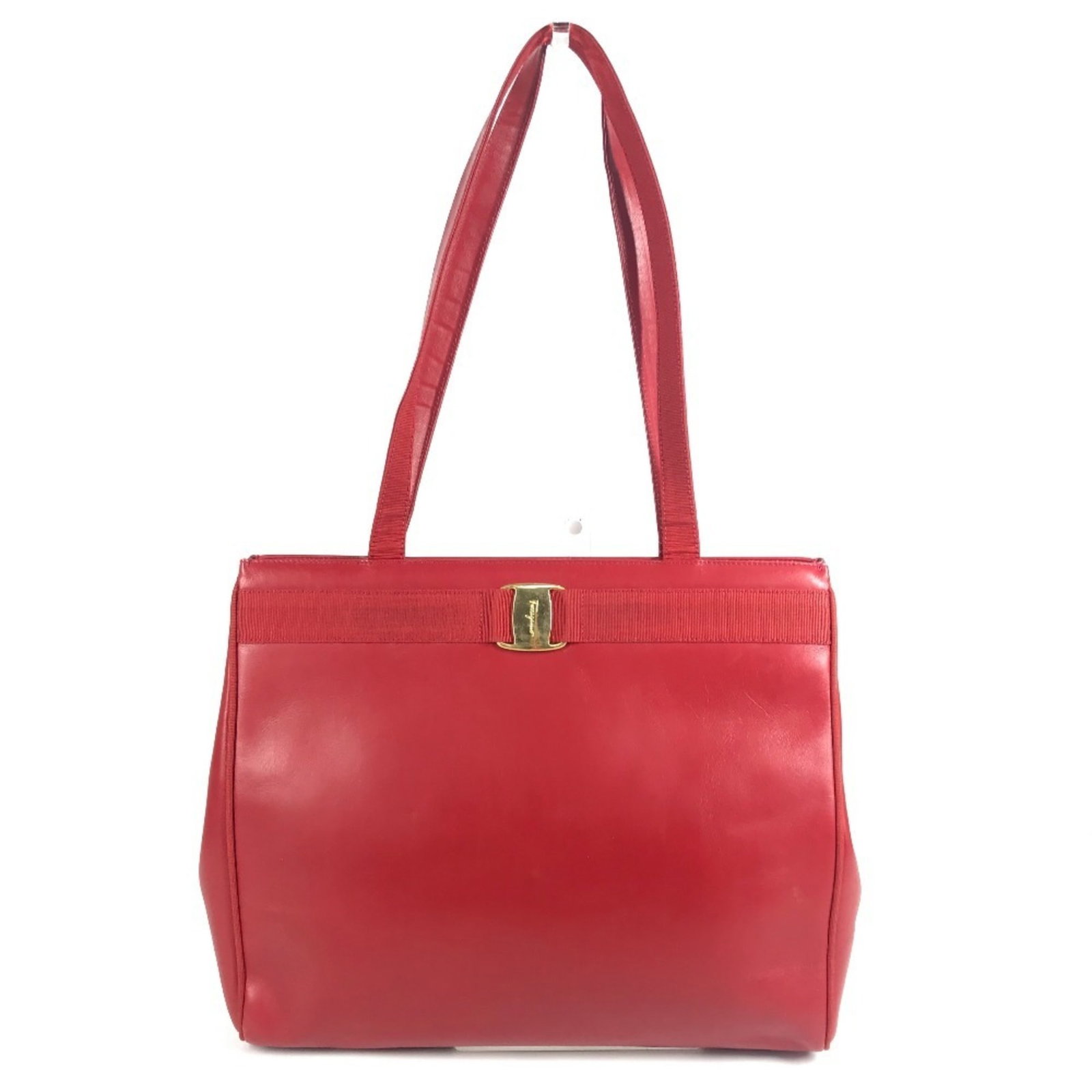 Salvatore Ferragamo Shoulder Bag Leather Tote: Salvatore Ferragamo Shoulder Bag Leather Tote Salvatore Ferragamo's iconic Vara line is represented in this stunning red leather shoulder bag tote, crafted from high-quality Italian leather. Measuring
