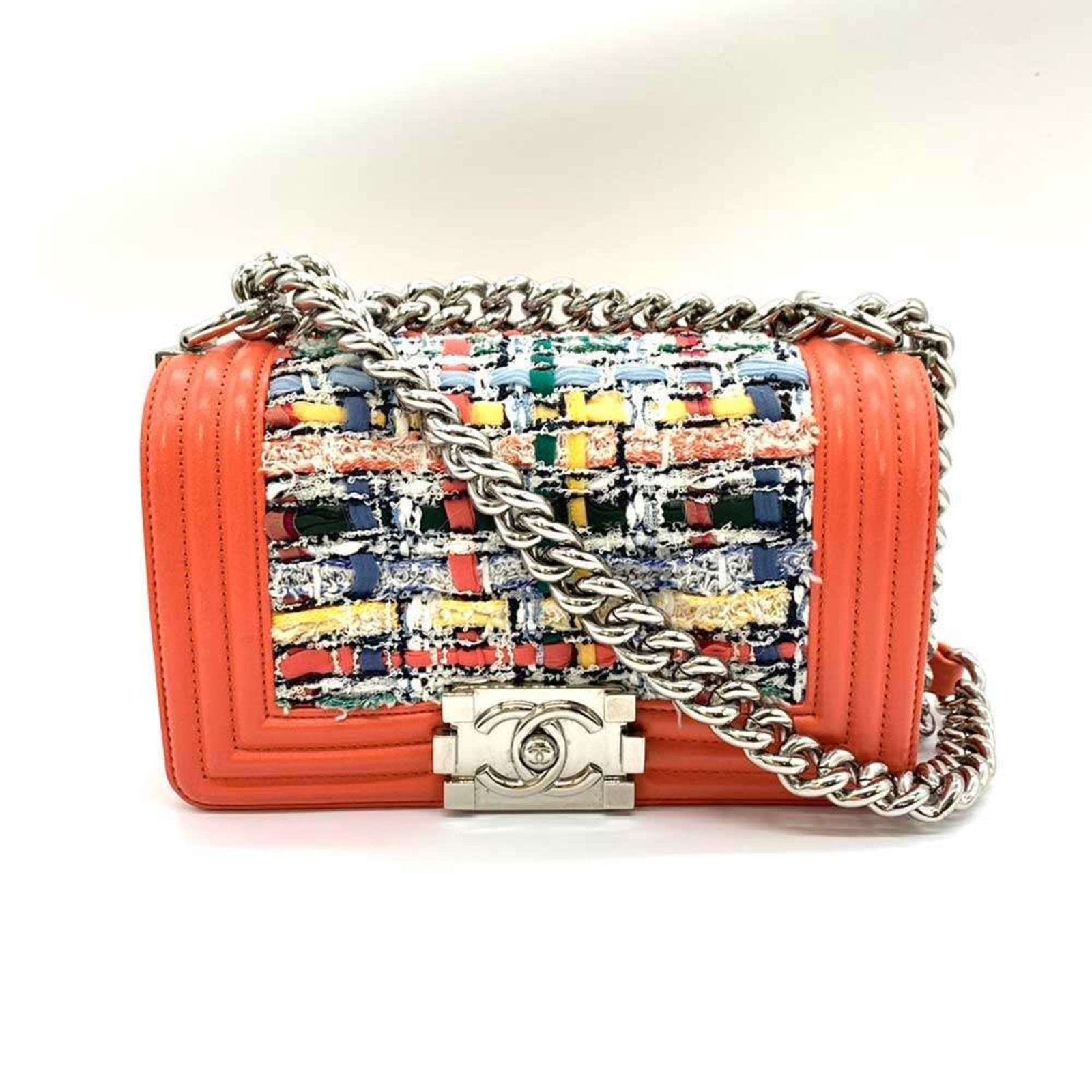 Tweed Leather Chanel Shoulder Bag: Tweed Leather Chanel Shoulder Bag Tweed Leather Chanel Shoulder Bag in vibrant coral orange, featuring an eye-catching multi-color design. This stylish shoulder bag boasts a sturdy construction with