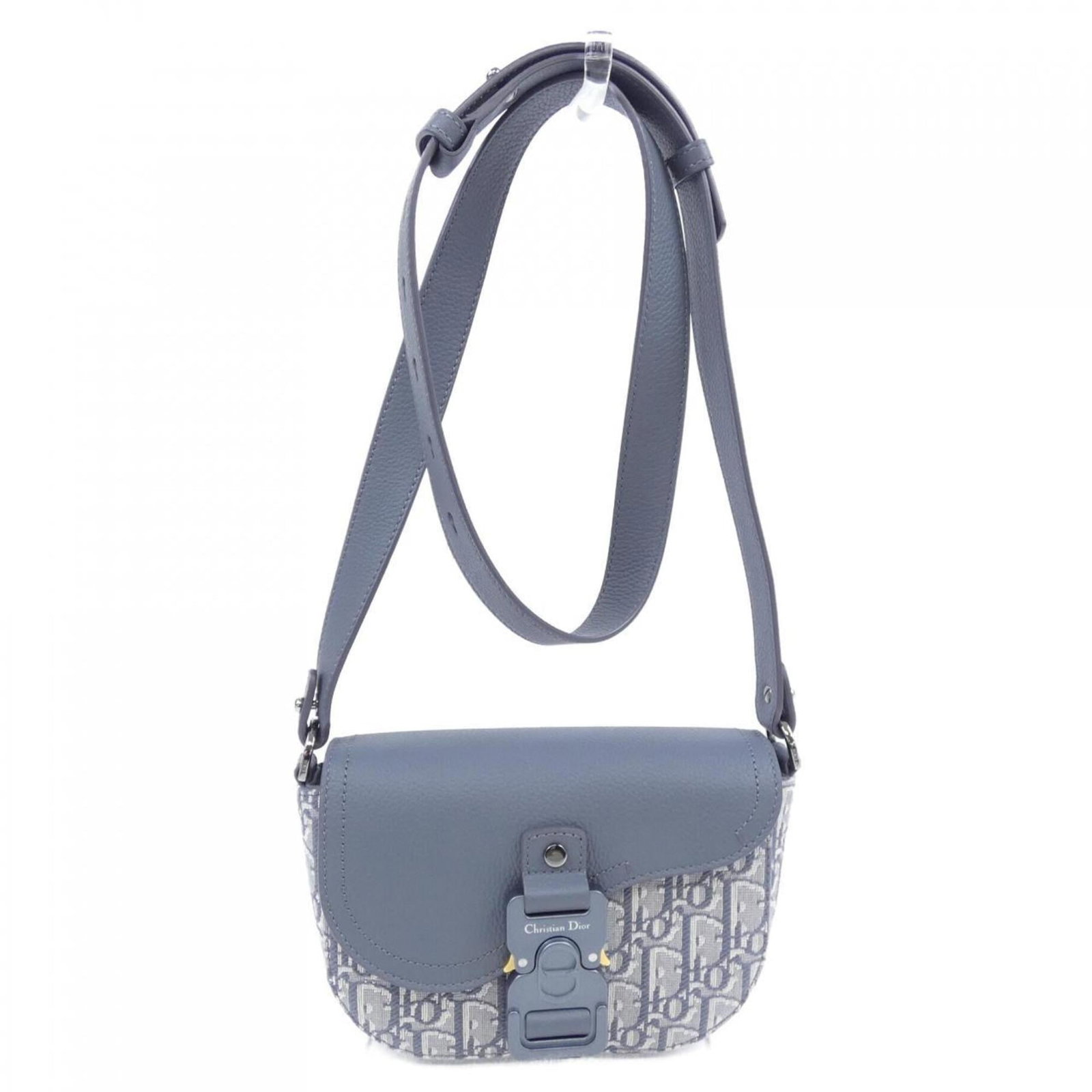 Handbag by Christian Dior: Handbag by Christian Dior The Christian Dior handbag boasts sleek, modern lines and a sophisticated gray hue. Measuring just 14cm x 21cm x 5cm, it's the perfect size for everyday carry. With its