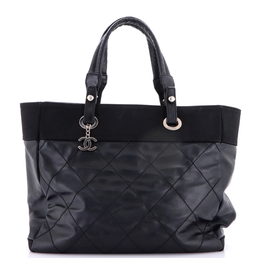 Quilted Coated Canvas Large Tote Chanel Biarritz: Quilted Coated Canvas Large Tote Chanel Biarritz Black quilted coated canvas large tote bag with silver hardware, measuring 12" high x 13.5" wide x 6" deep, featuring a classic Chanel Biarritz