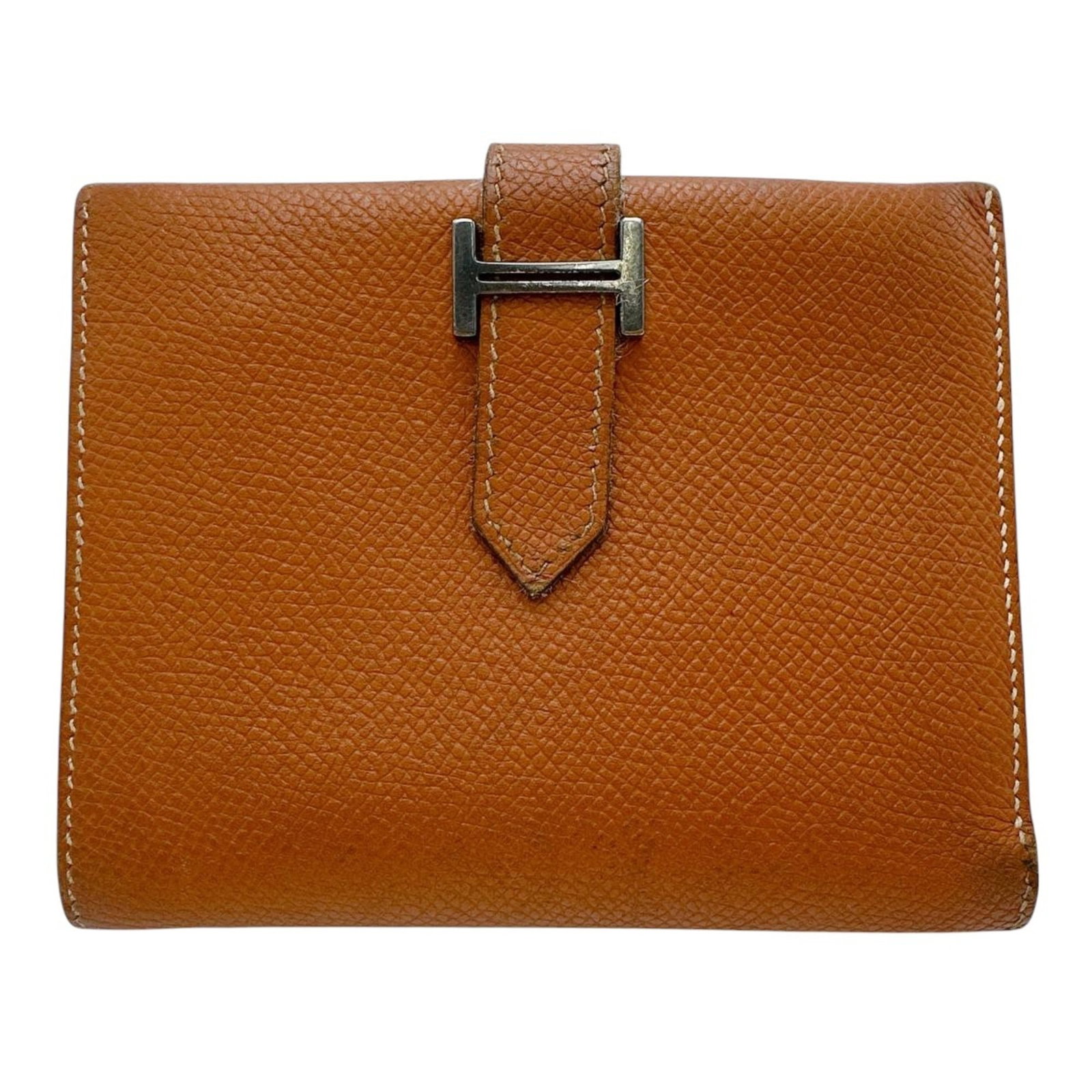 Hermes bi fold wallet: Hermes bi fold wallet Brown bi-fold wallet from Hermes, measuring 9.5cm x 12cm x 1.5cm, with classic French design and subtle details. This stylish wallet features a rich brown leather exterior and in