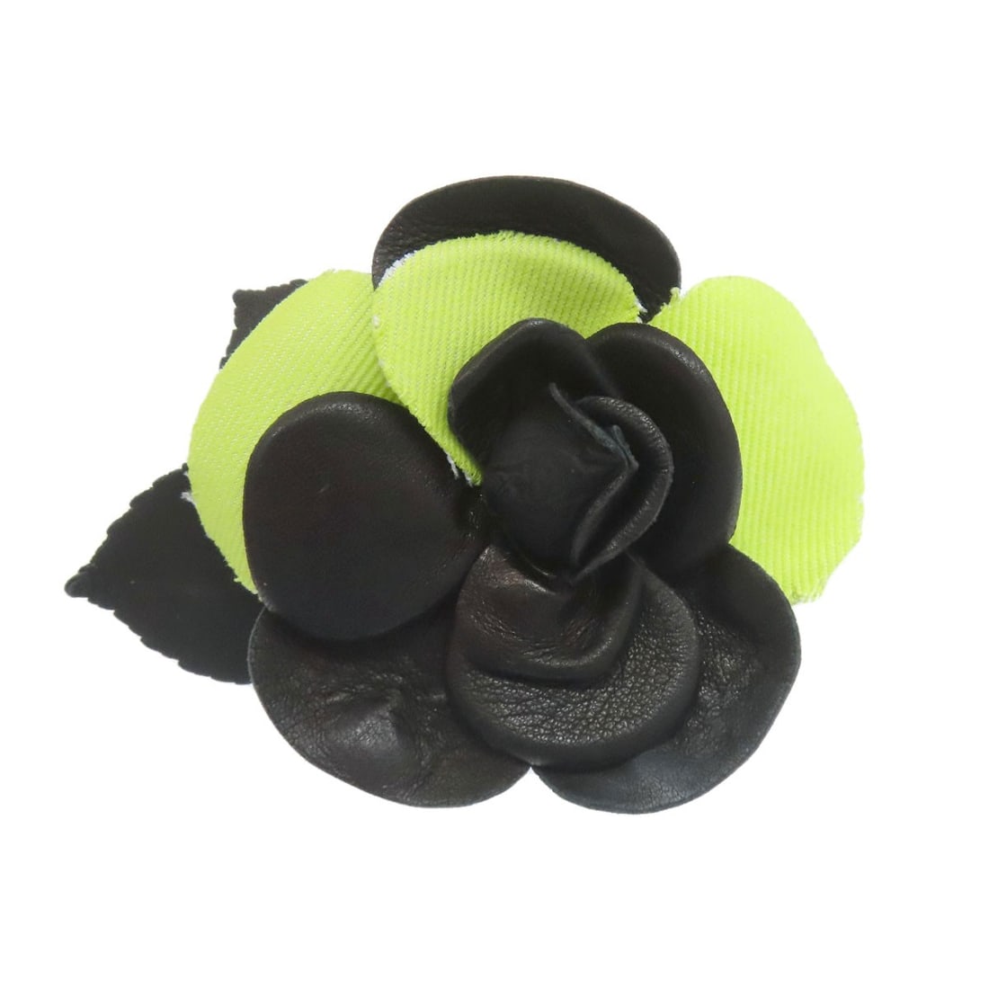 Camelia Brooch Leather by Chanel: Camelia Brooch Leather by Chanel Black leather brooch by CHANEL, featuring a classic design. This stylish accessory boasts a sleek black exterior and premium leather material. A timeless piece that
