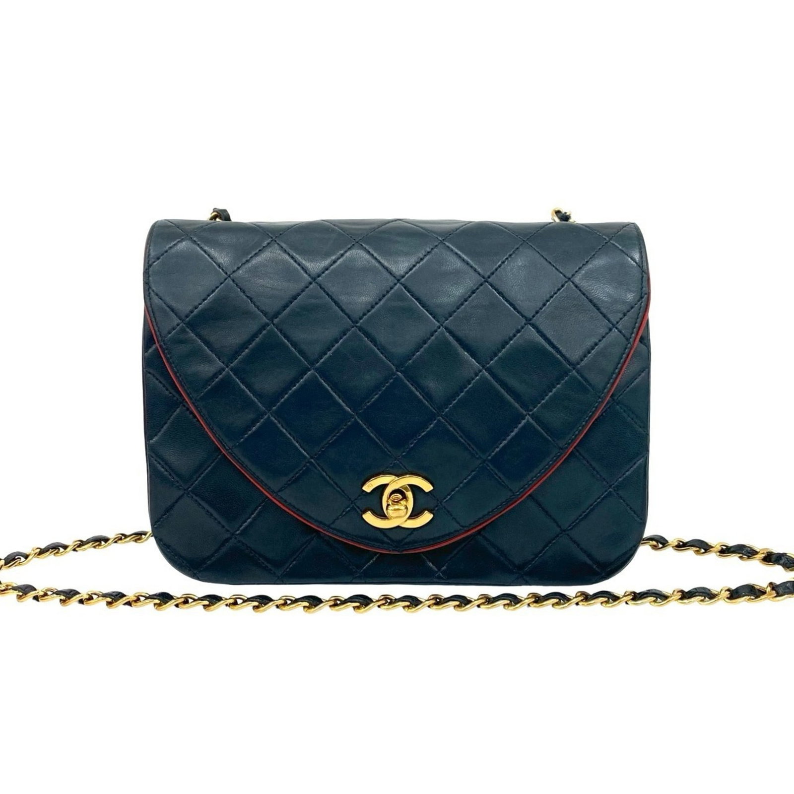 Shoulder Bag Leather Chanel: Shoulder Bag Leather Chanel Navy and red lambskin shoulder bag from Chanel, made with high-quality leather. This classic design features a timeless combination of colors and a sleek, modern shape.
